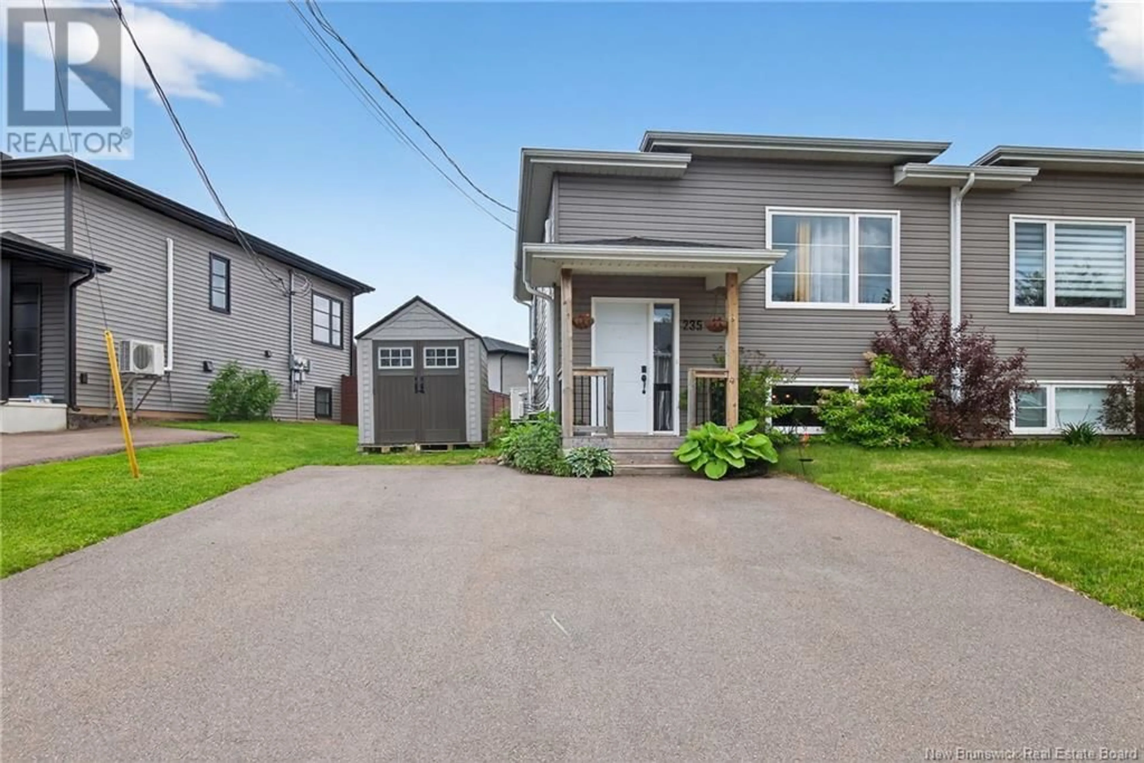 Home with vinyl exterior material, street for 235 BELLE FORET STREET, Dieppe New Brunswick E1A9E6