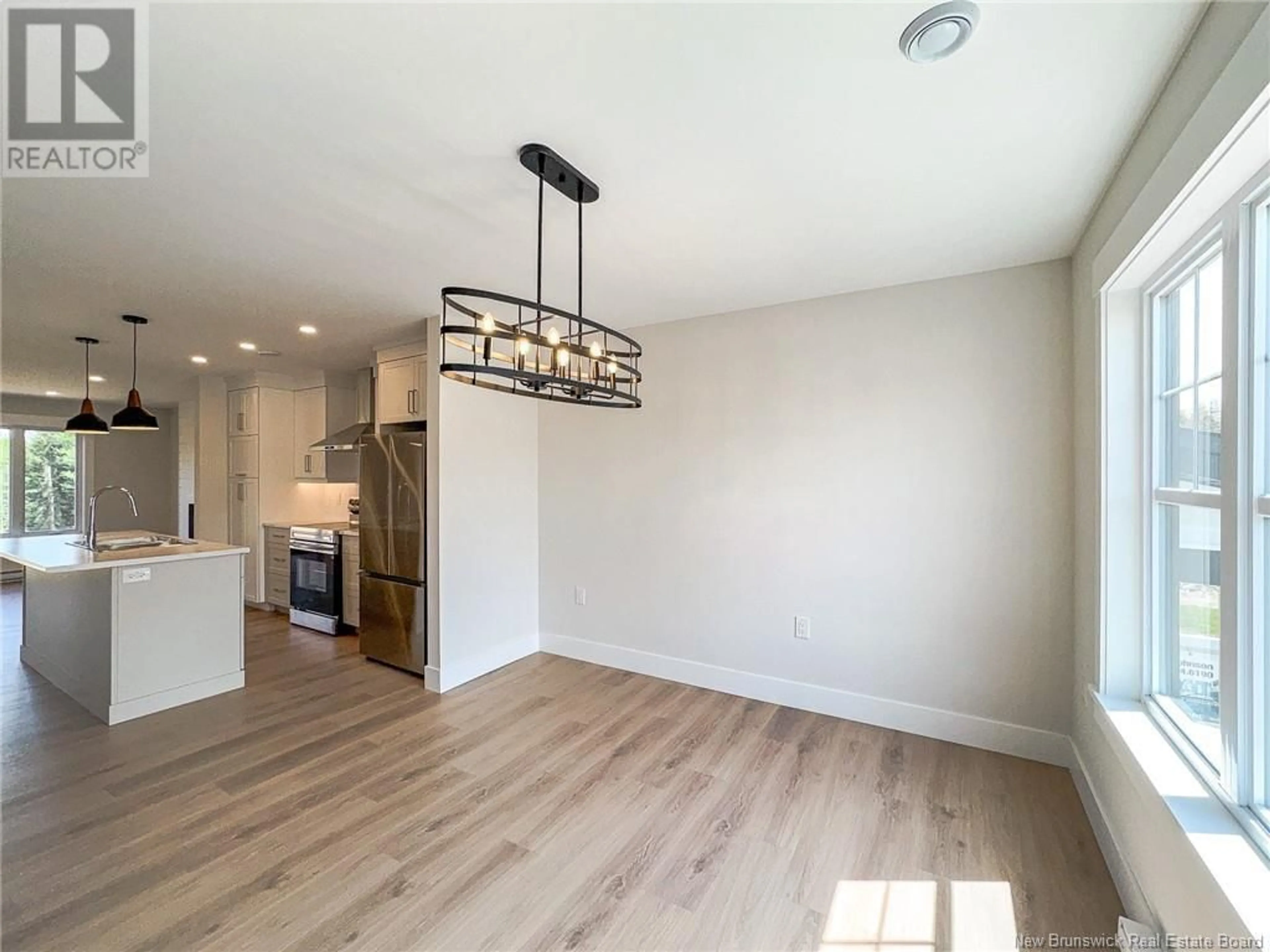 Open concept kitchen, wood/laminate floor for 136 ELSLIGER STREET, Dieppe New Brunswick E1A7X9