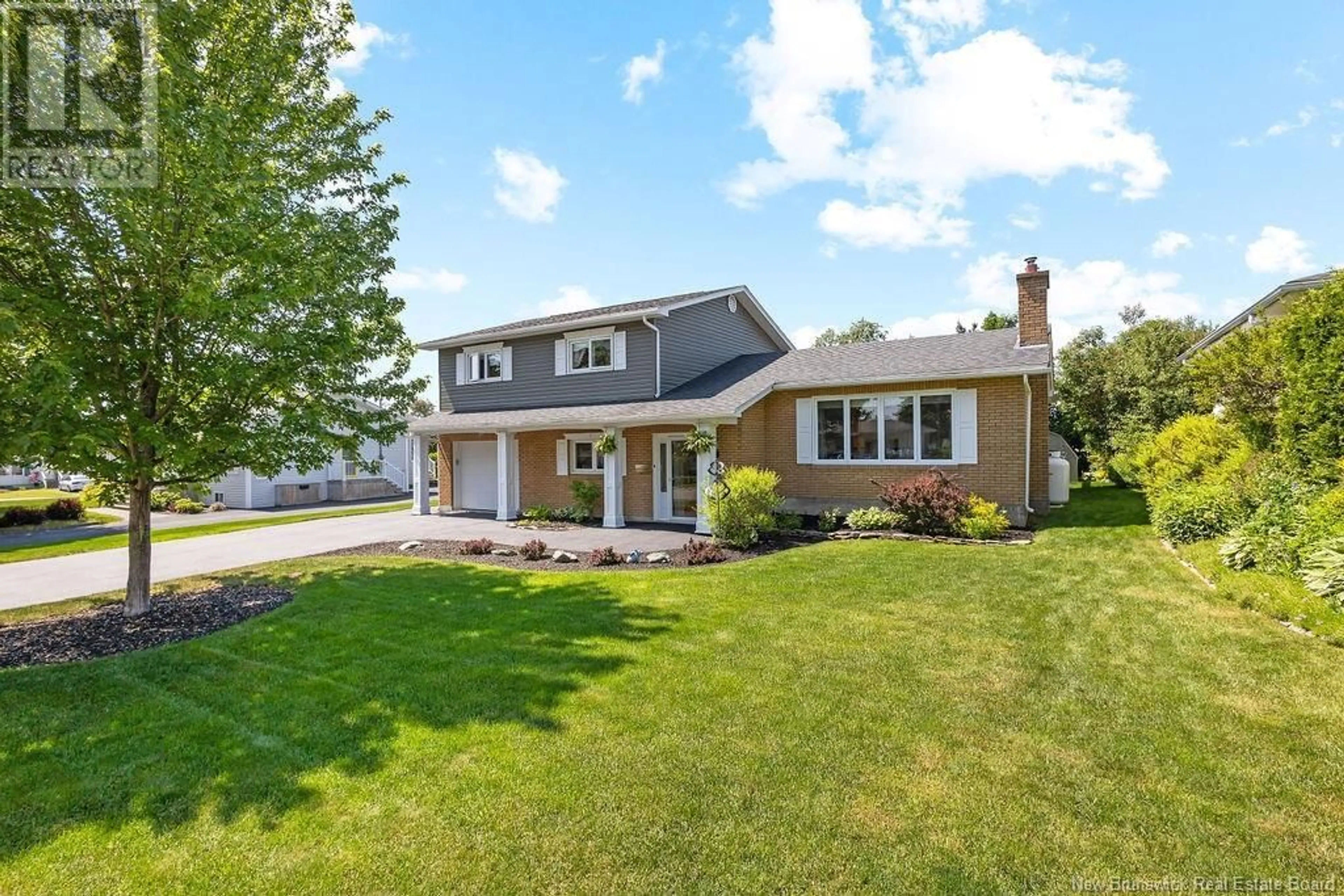 Home with vinyl exterior material, street for 293 MILLAR AVENUE, Miramichi New Brunswick E1V3B7