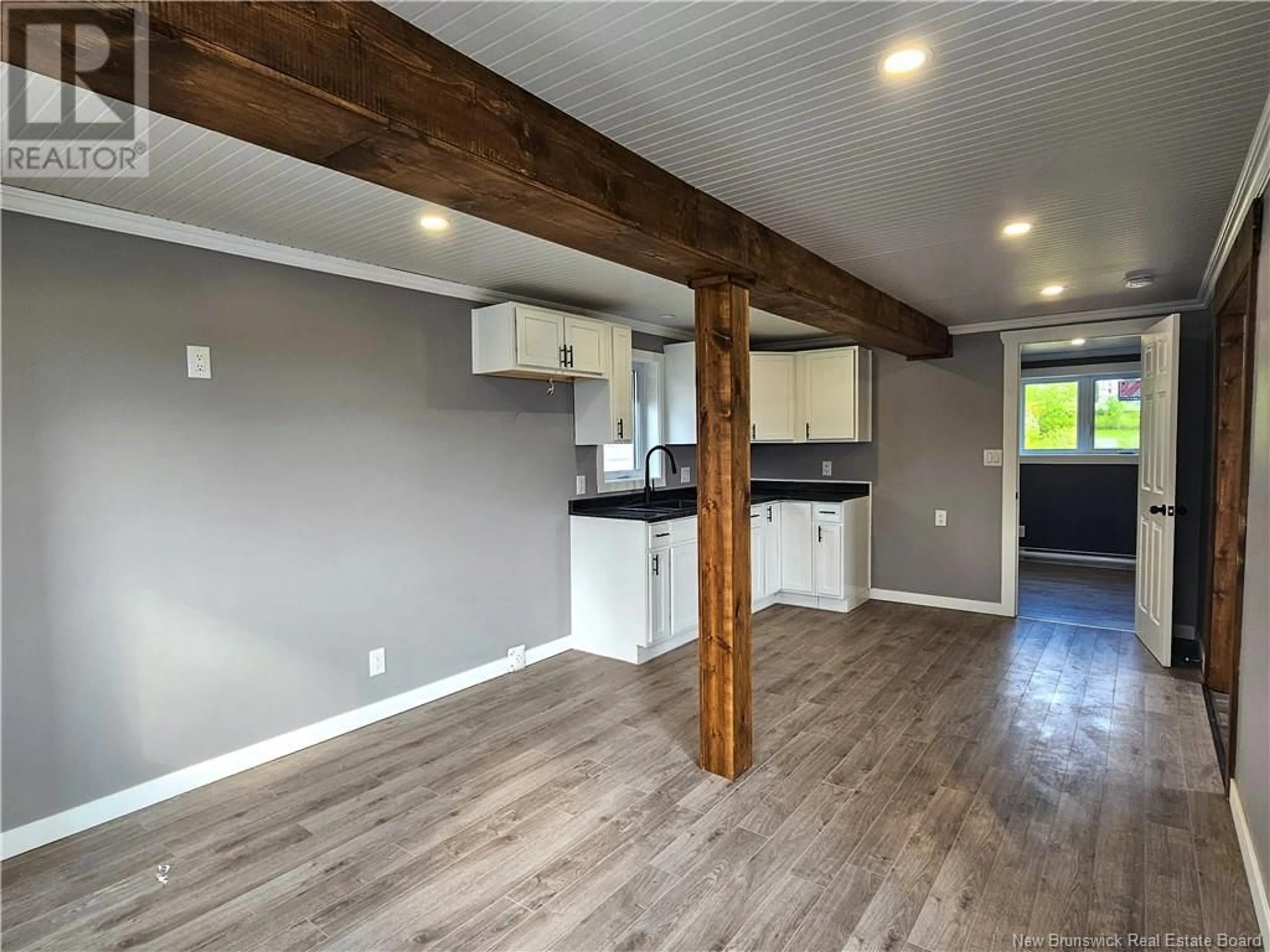 Open concept kitchen, wood/laminate floor for 117 34TH AVENUE, Edmundston New Brunswick E3V2T4