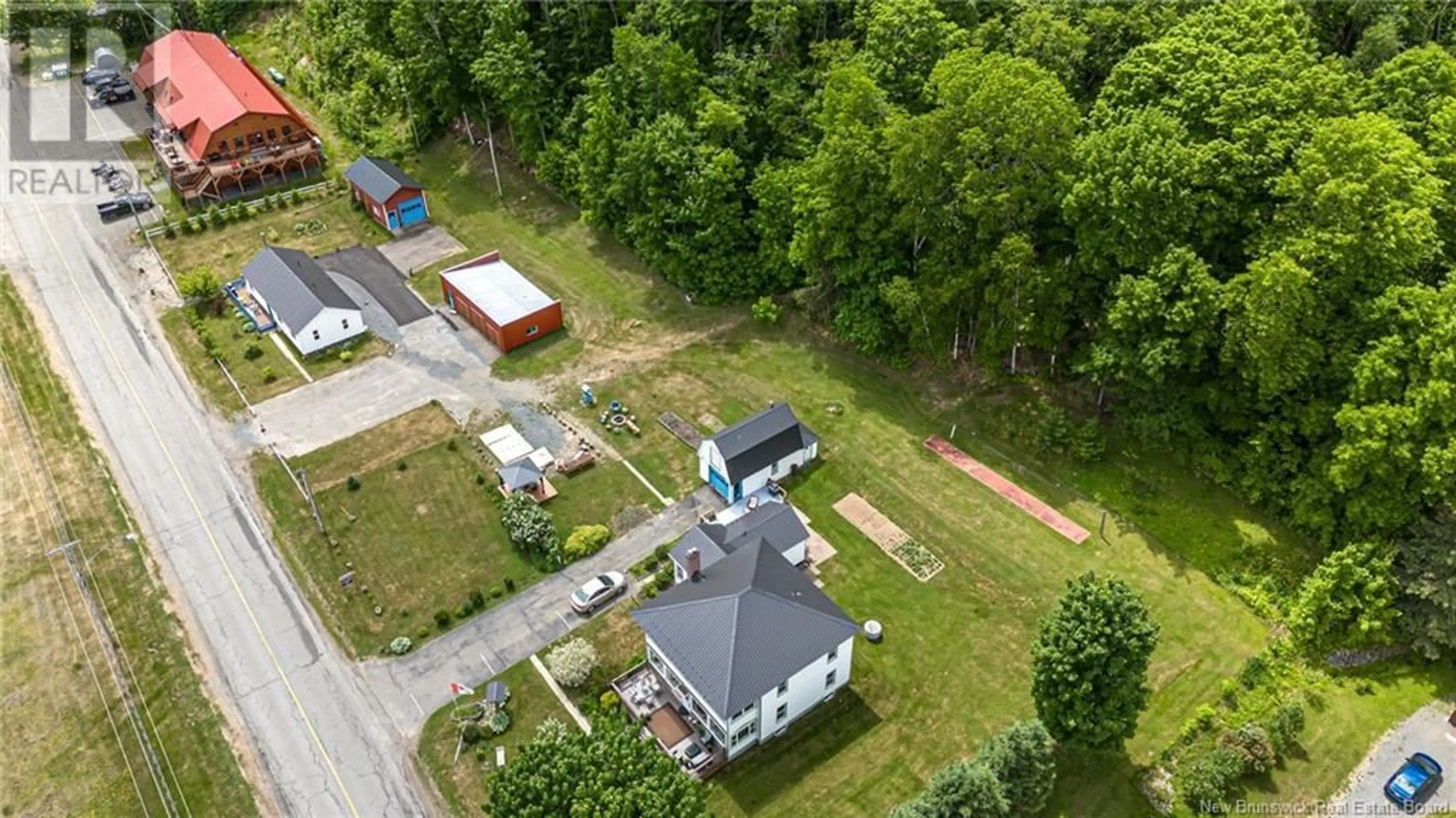 A pic from outside/outdoor area/front of a property/back of a property/a pic from drone, unknown for 519-531 OTIS DRIVE, Nackawic New Brunswick E6G1H6