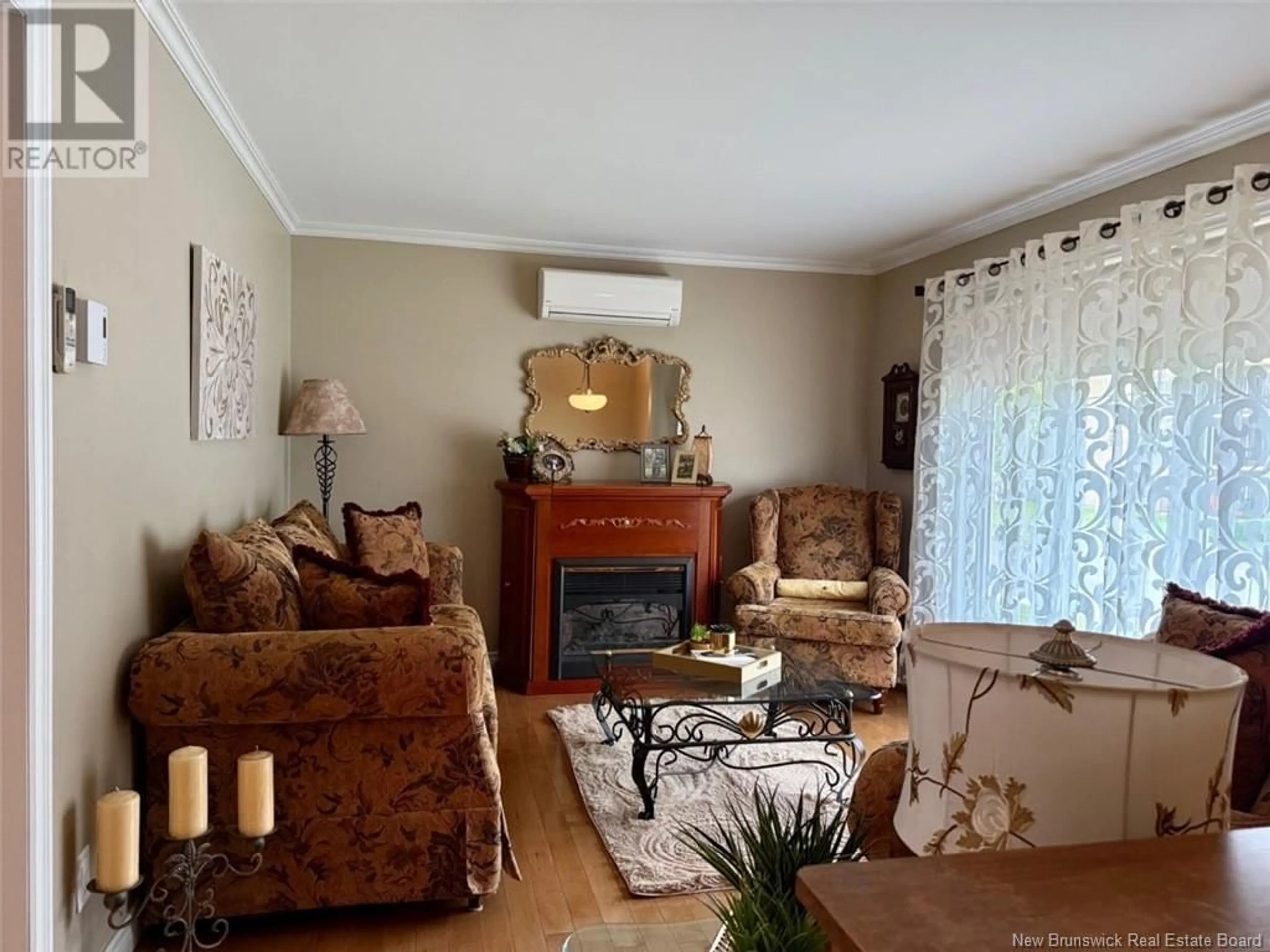 Living room with furniture, wood/laminate floor for 291 DOVER STREET, Campbellton New Brunswick E3N3L5