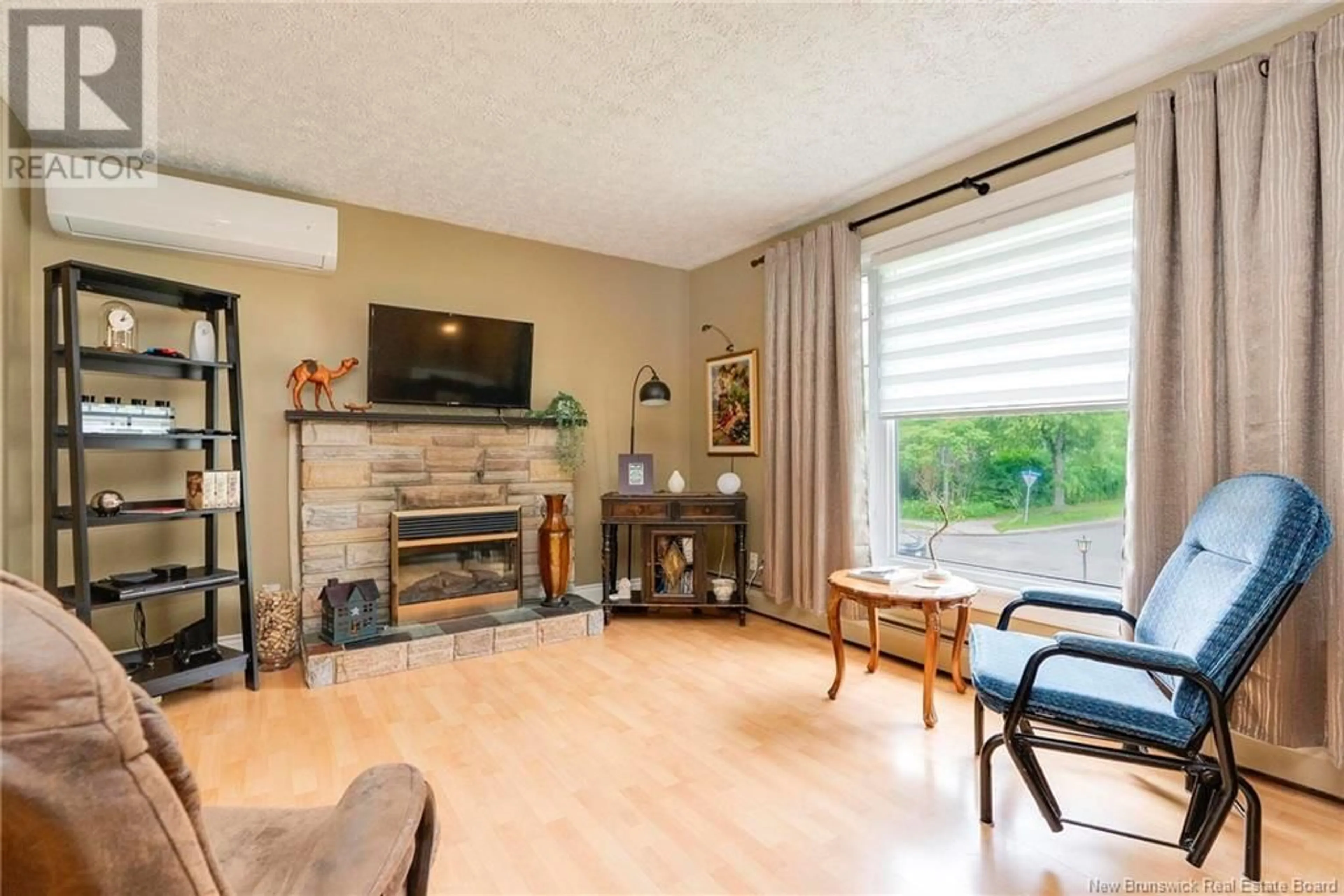 Living room with furniture, wood/laminate floor for 22 WILLIAM STREET, Fredericton New Brunswick E3A4V6