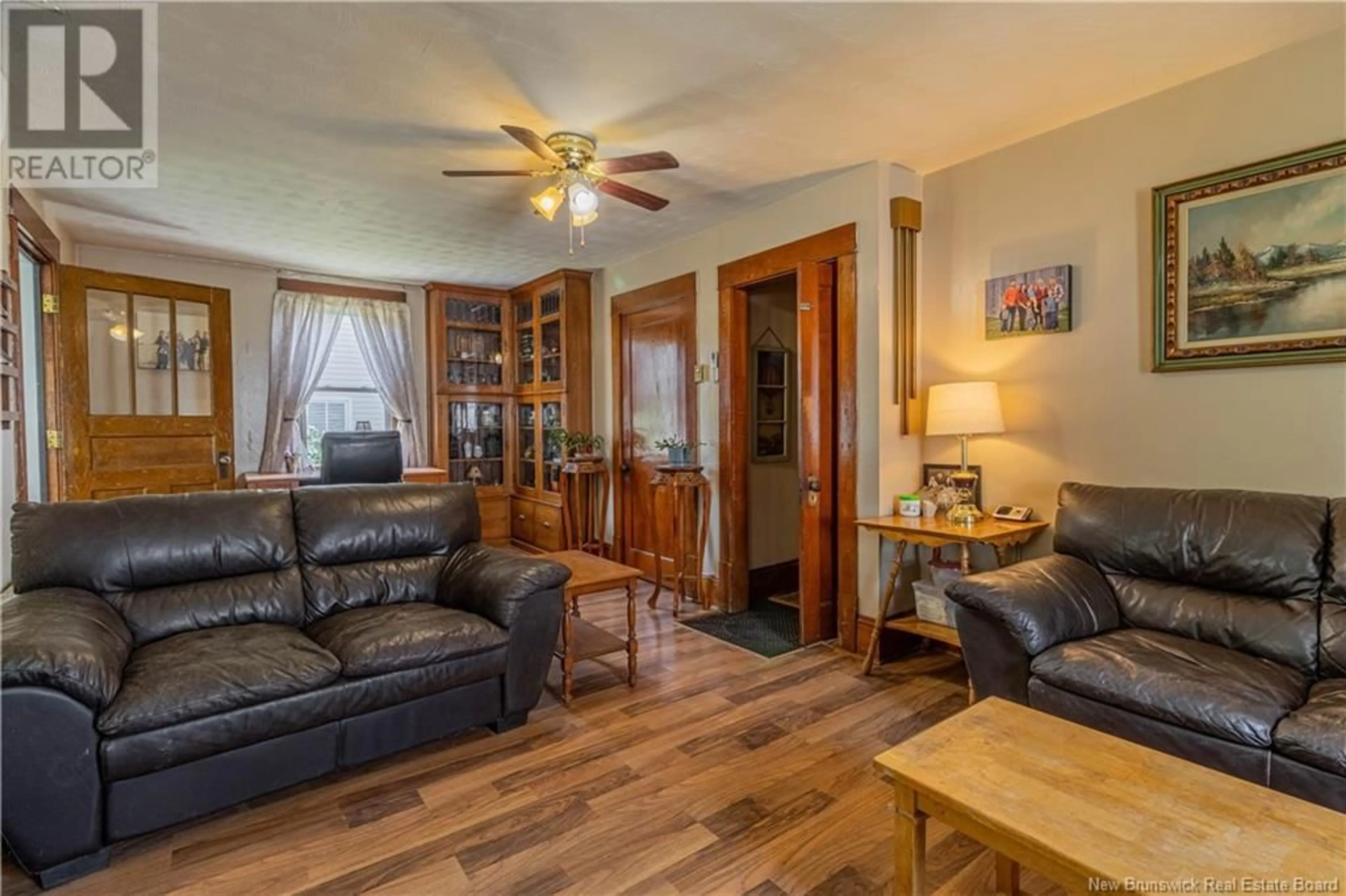 Living room with furniture, wood/laminate floor for 1105 MAIN STREET, Sussex Corner New Brunswick E4E2Z9