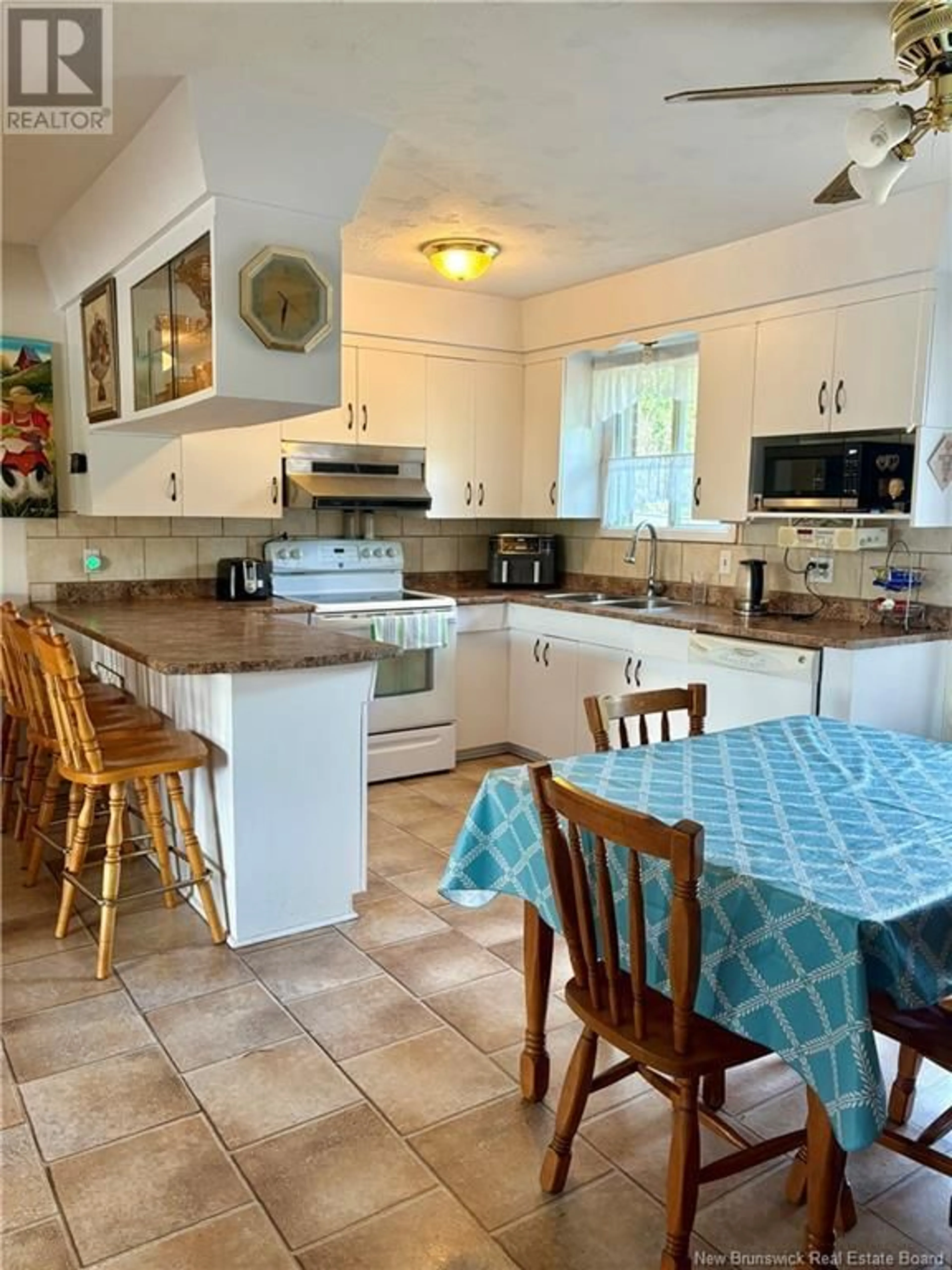 Open concept kitchen, ceramic/tile floor for 869 VICTORIA STREET, Edmundston New Brunswick E3V3T4