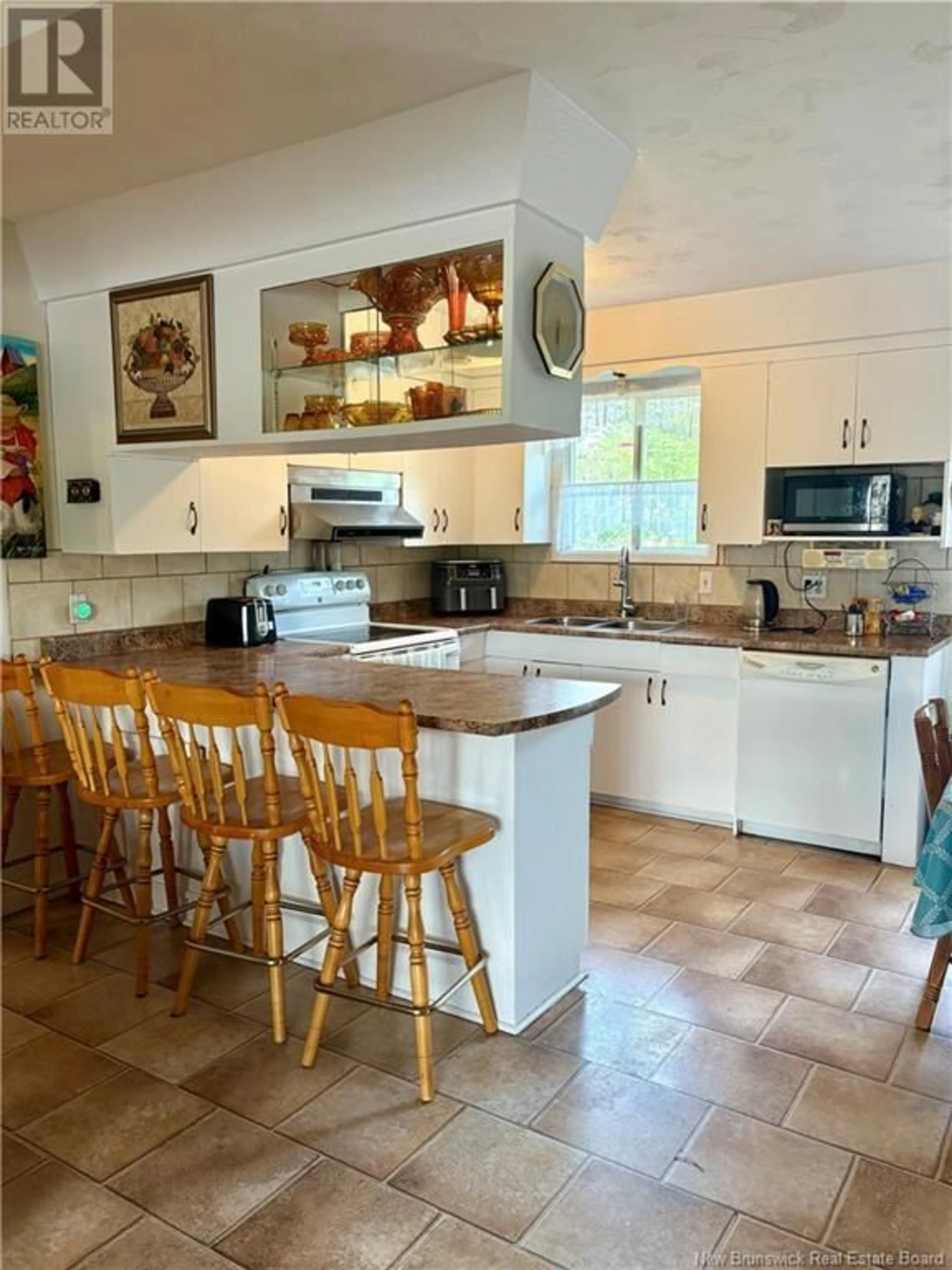 Open concept kitchen, ceramic/tile floor for 869 VICTORIA STREET, Edmundston New Brunswick E3V3T4