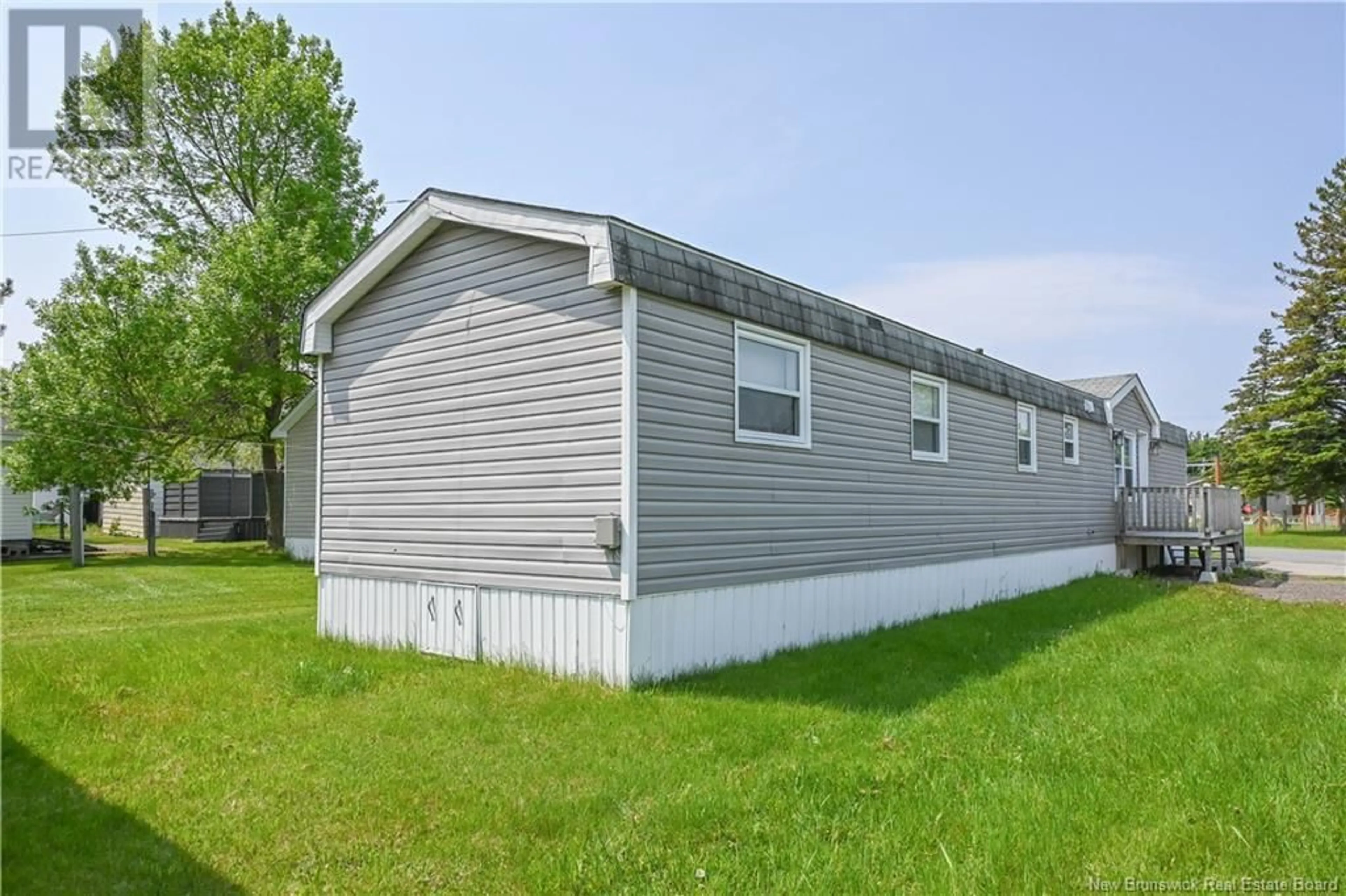 Home with vinyl exterior material, unknown for 70 RUE DU PARC, Caraquet New Brunswick E1W1A7