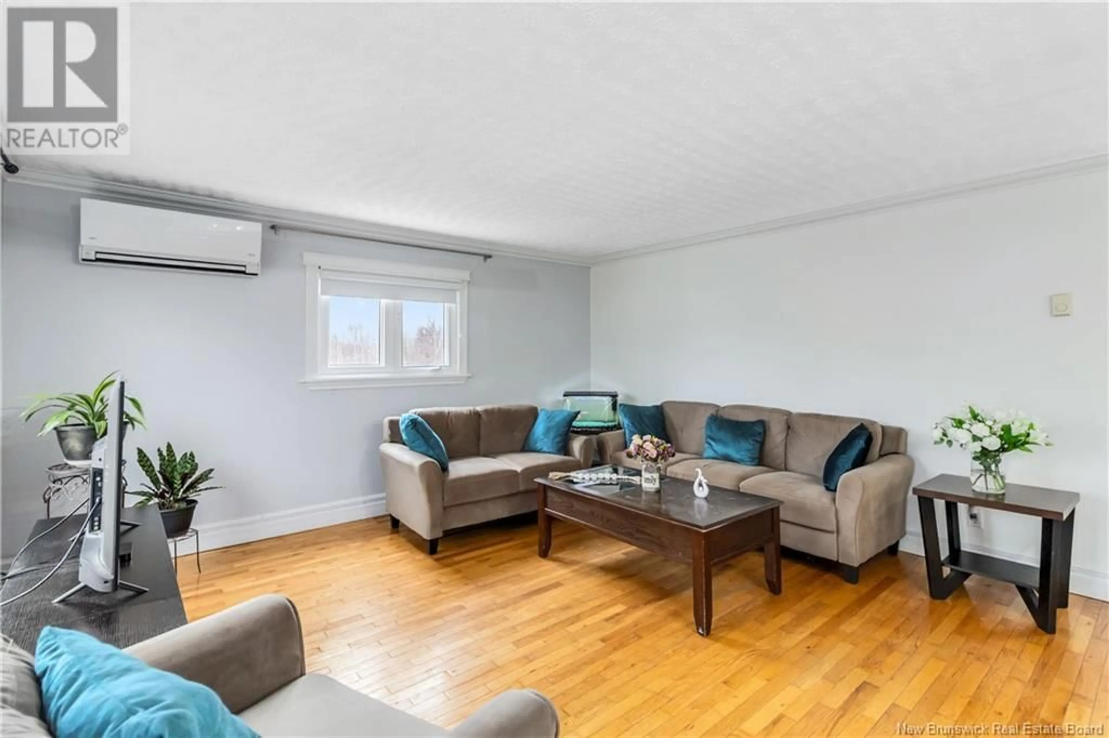 Living room with furniture, wood/laminate floor for 51 POINTE AUX BOULEAUX ROAD, Grand-Barachois New Brunswick E4P7Z7
