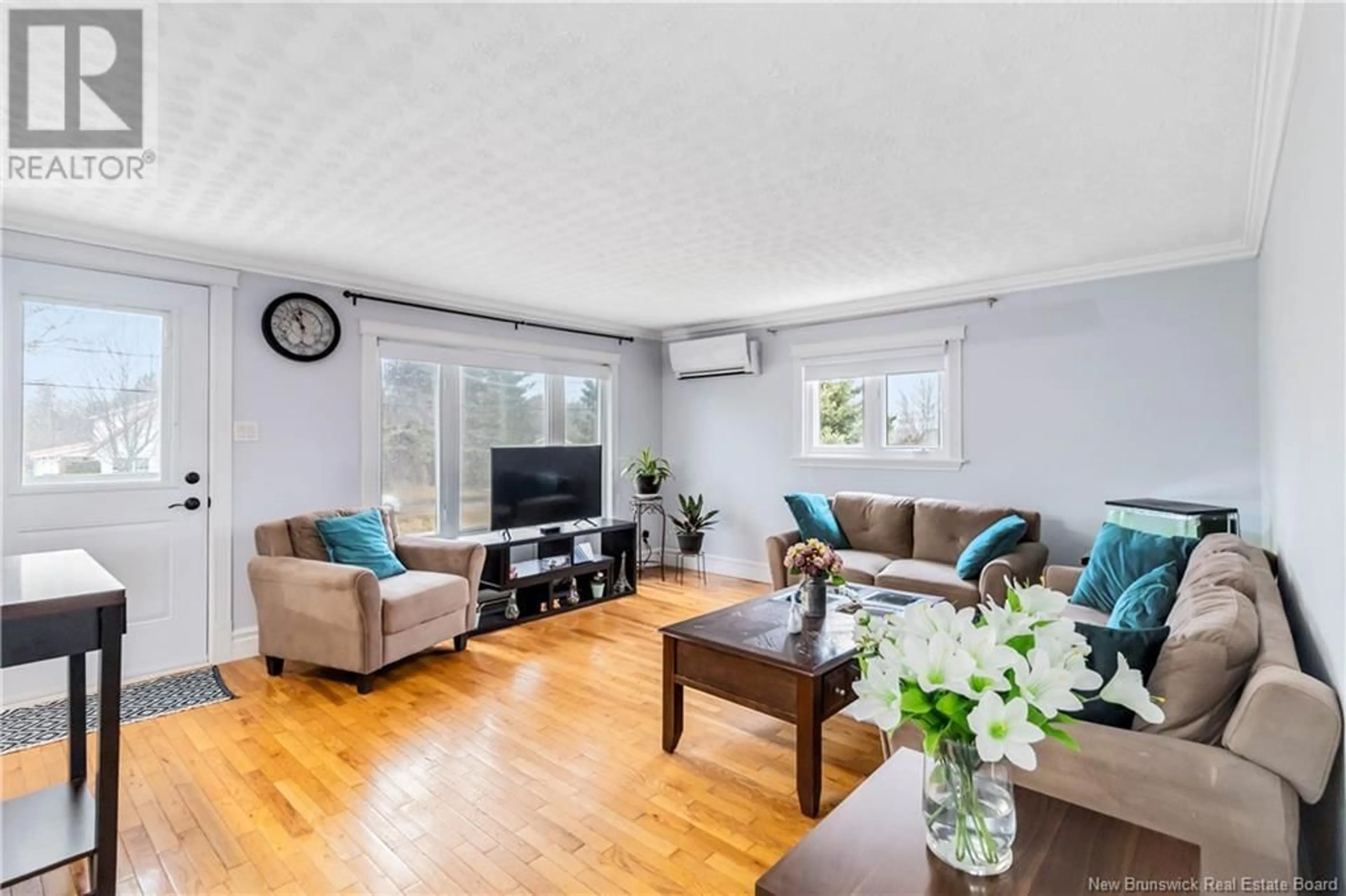 Living room with furniture, wood/laminate floor for 51 POINTE AUX BOULEAUX ROAD, Grand-Barachois New Brunswick E4P7Z7