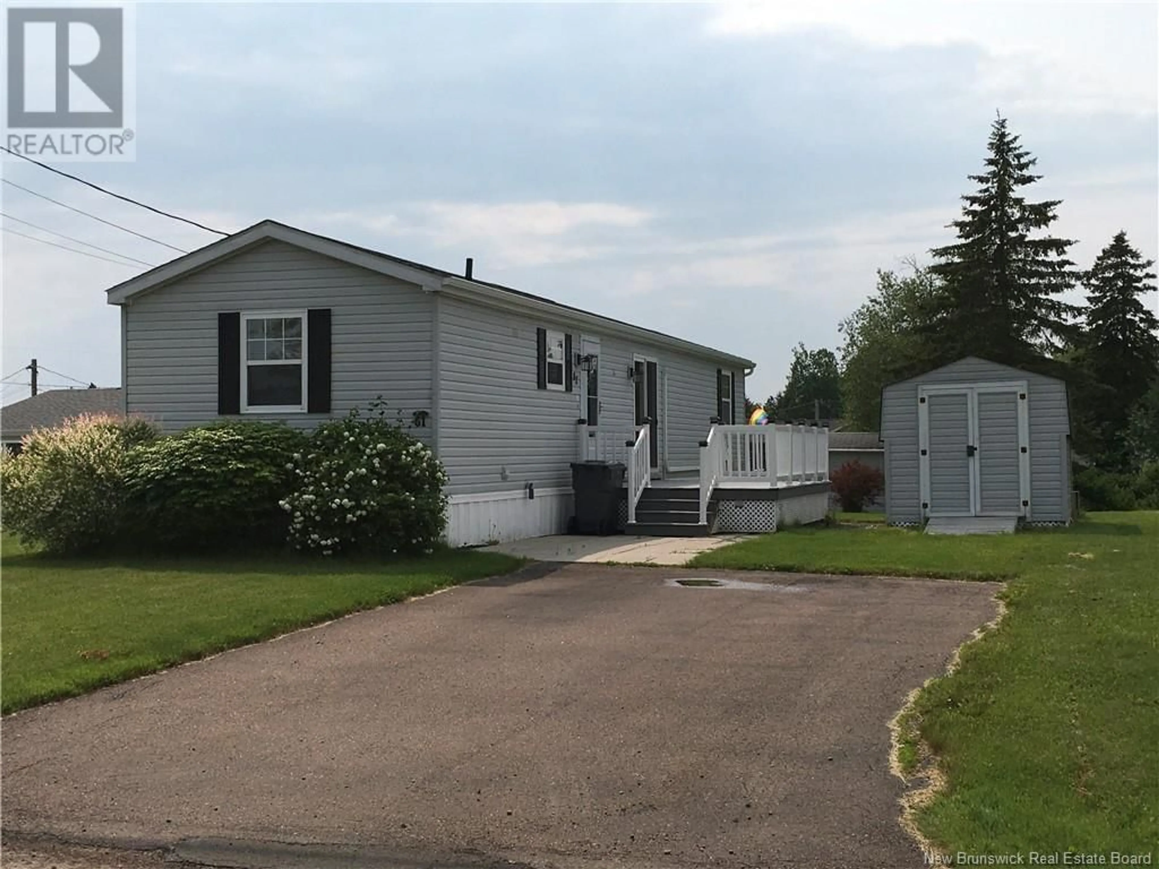 Home with vinyl exterior material, street for 61 ST-JEAN DRIVE, Dieppe New Brunswick E1A7N1