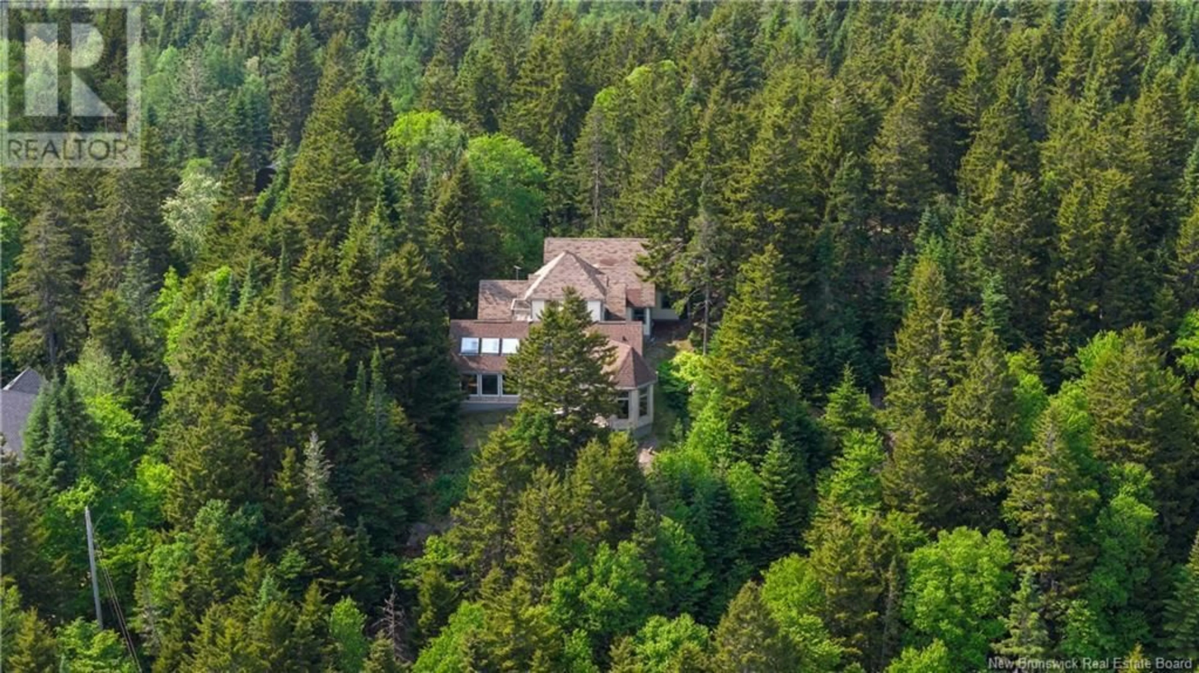A pic from outside/outdoor area/front of a property/back of a property/a pic from drone, forest/trees view for 12 ROCK RIDGE LANE, Clifton Royal New Brunswick E5S1K5