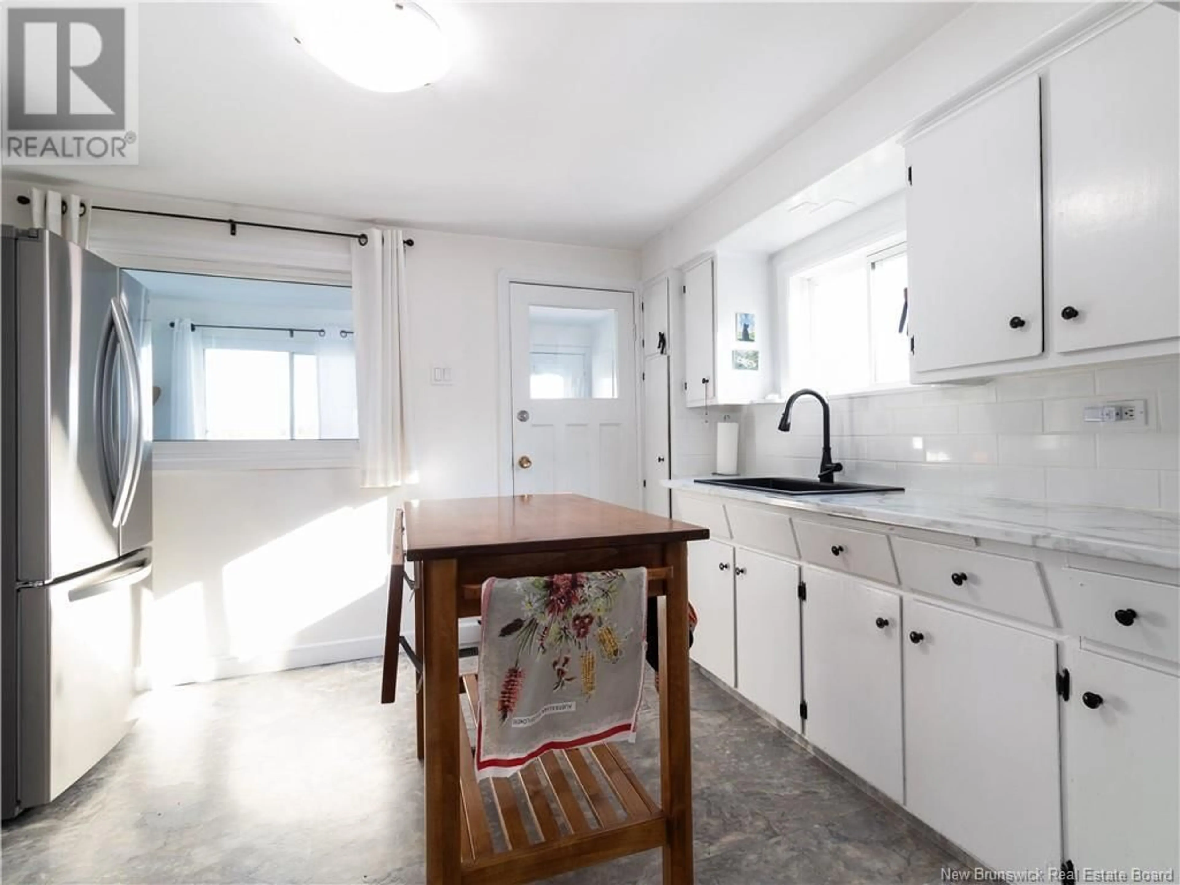 Open concept kitchen, ceramic/tile floor for 14 PENNY LANE, Moncton New Brunswick E1E2Z1