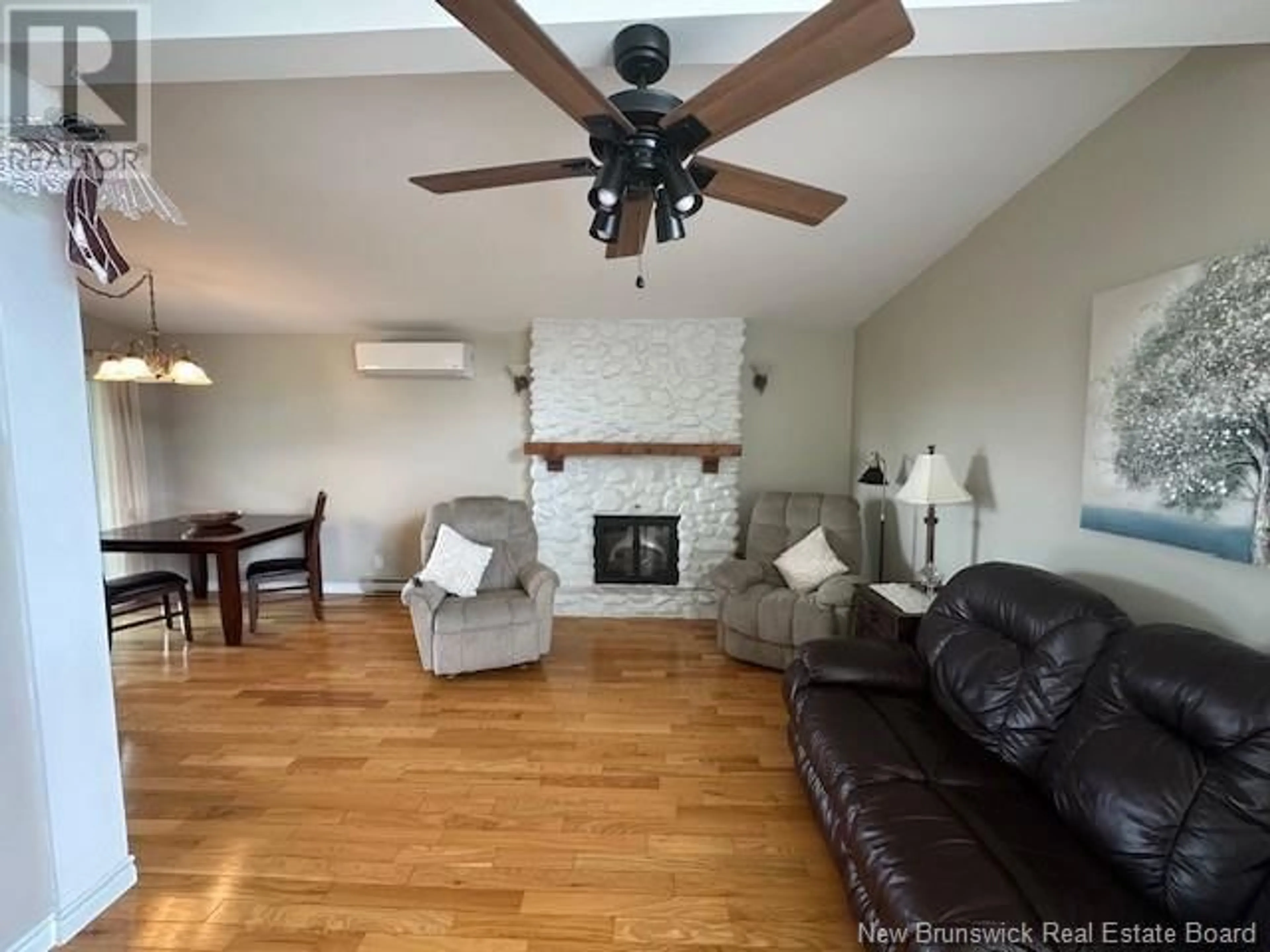 Living room with furniture, wood/laminate floor for 218 CENTENNIAL HEIGHTS STREET, Dalhousie New Brunswick E8C1K4