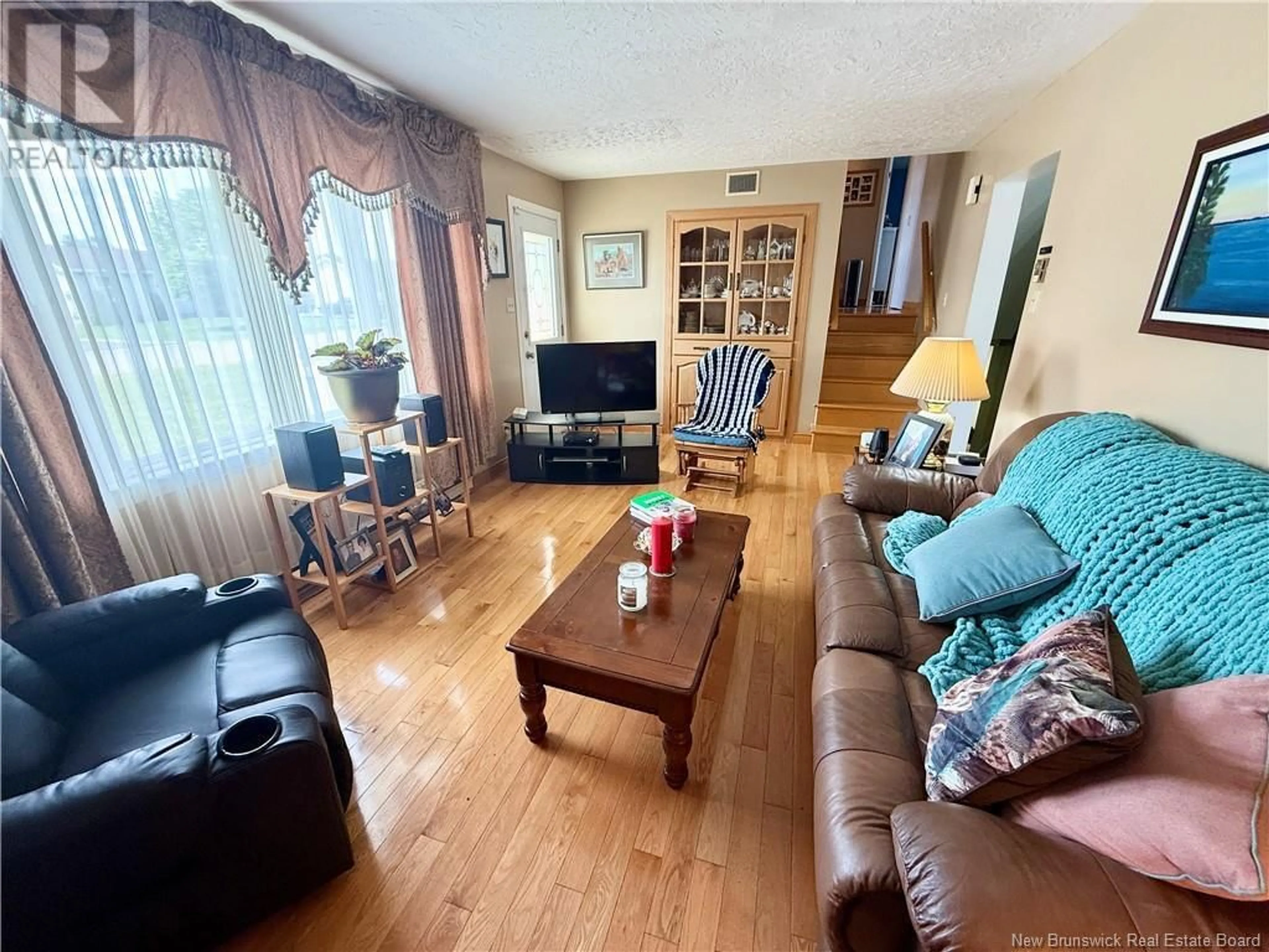Living room with furniture, wood/laminate floor for 860 DUNCAN COURT, Bathurst New Brunswick E2A2V4