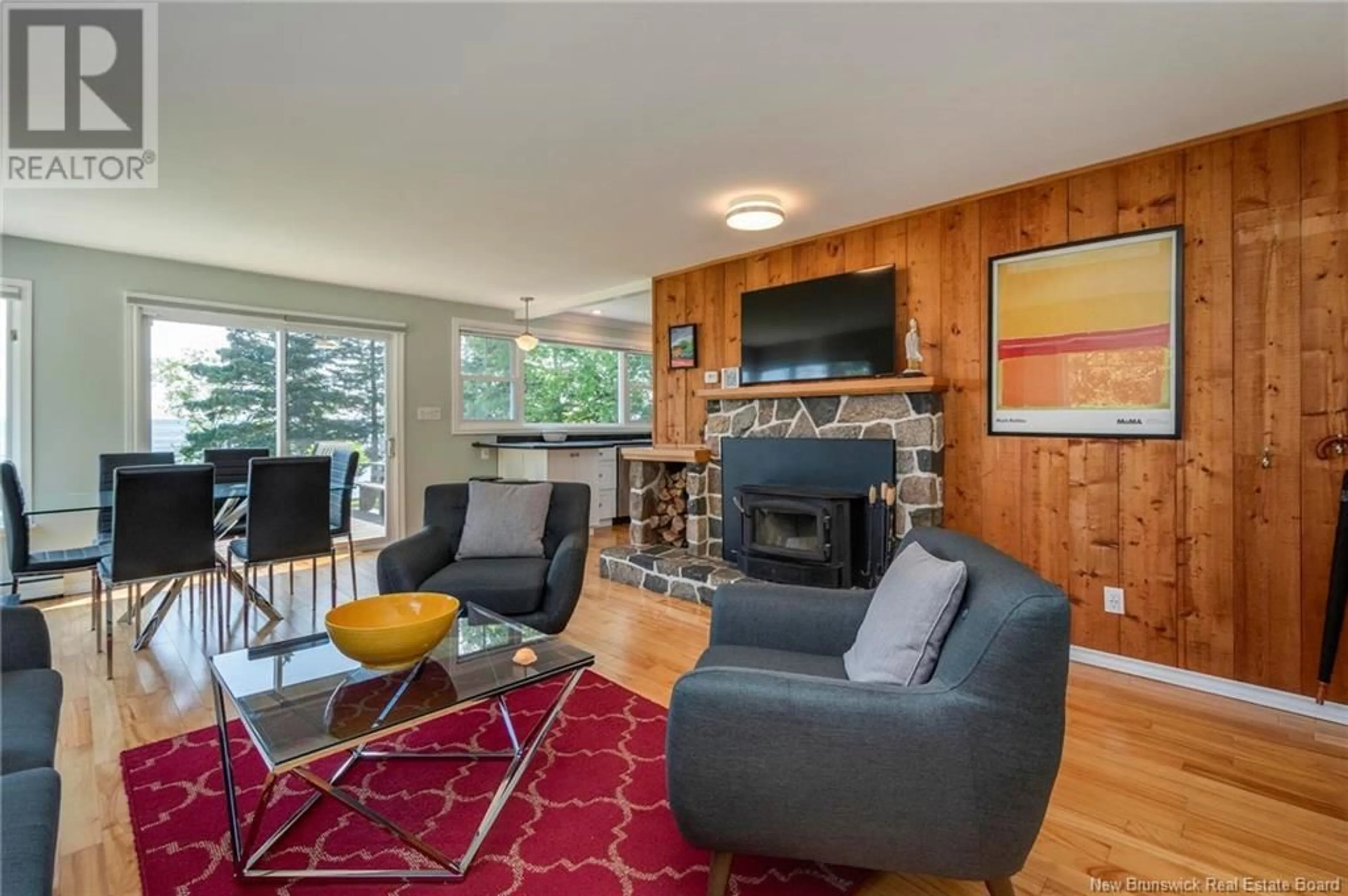 Living room with furniture, wood/laminate floor for 3 SCICHILONE, Rothesay New Brunswick E2E2B4