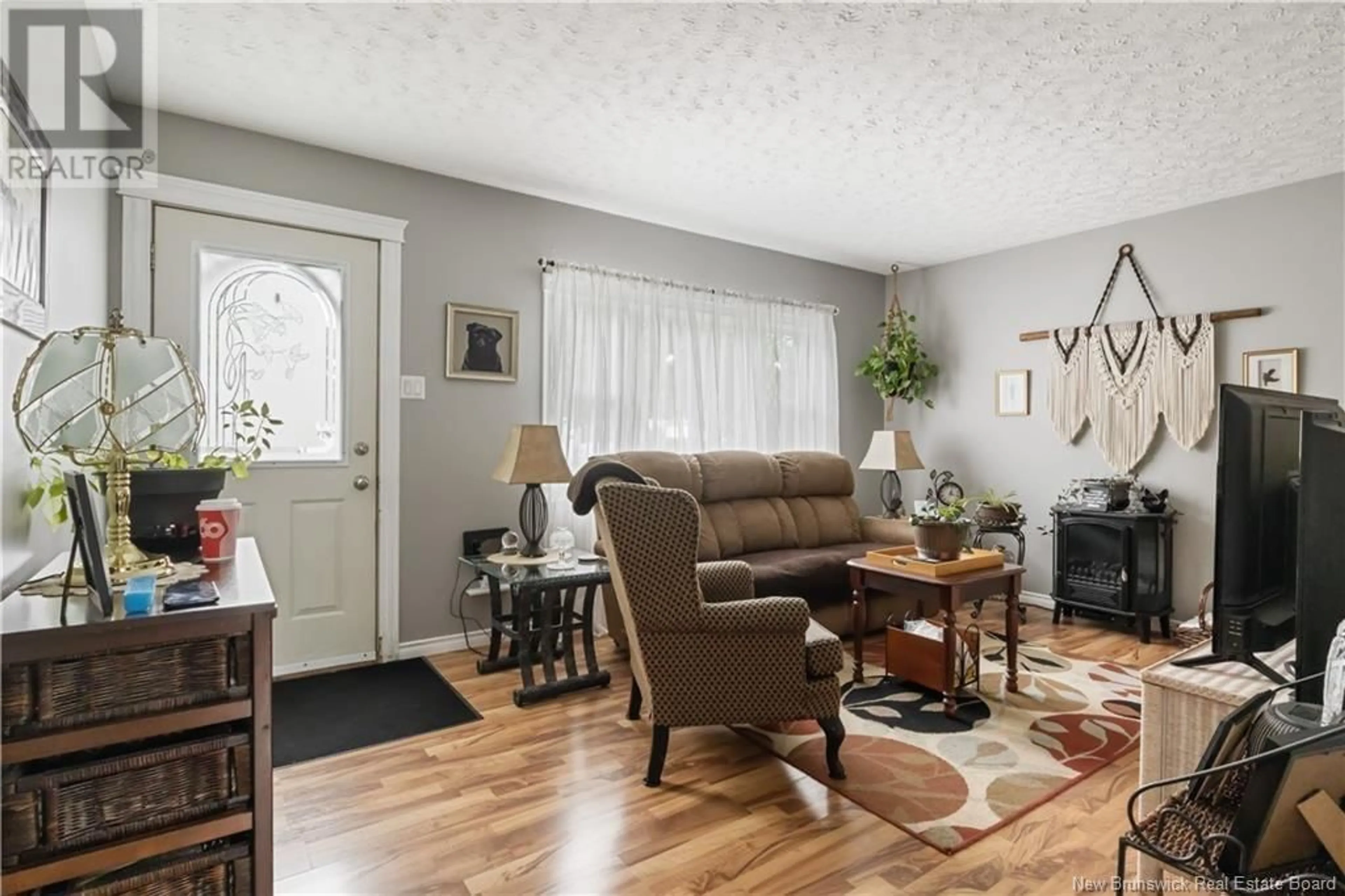 Living room with furniture, wood/laminate floor for 271 WHITEPINE, Riverview New Brunswick E1B2X2
