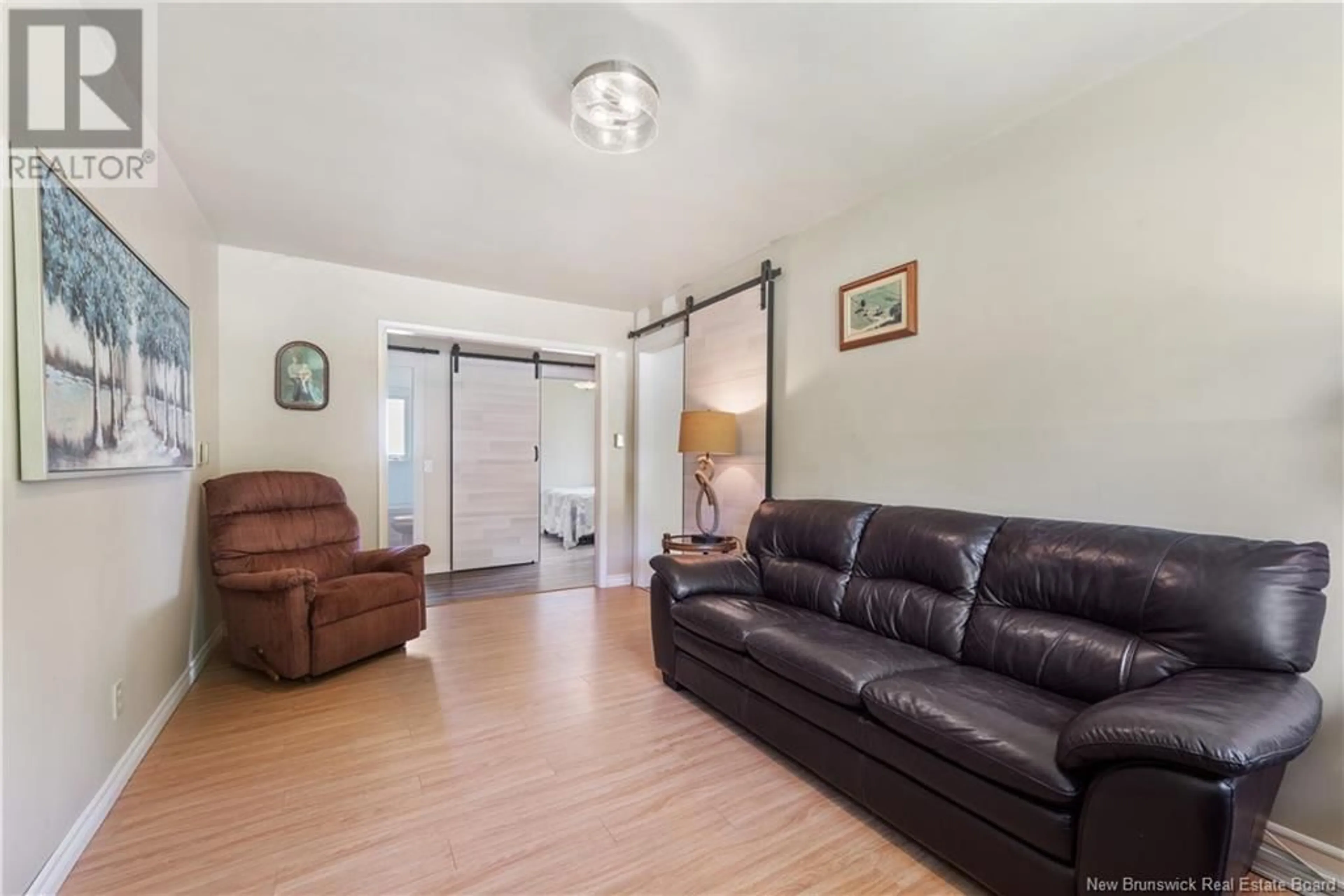 Living room with furniture, wood/laminate floor for 5141 ROUTE 114, Shepody New Brunswick E4H4K6