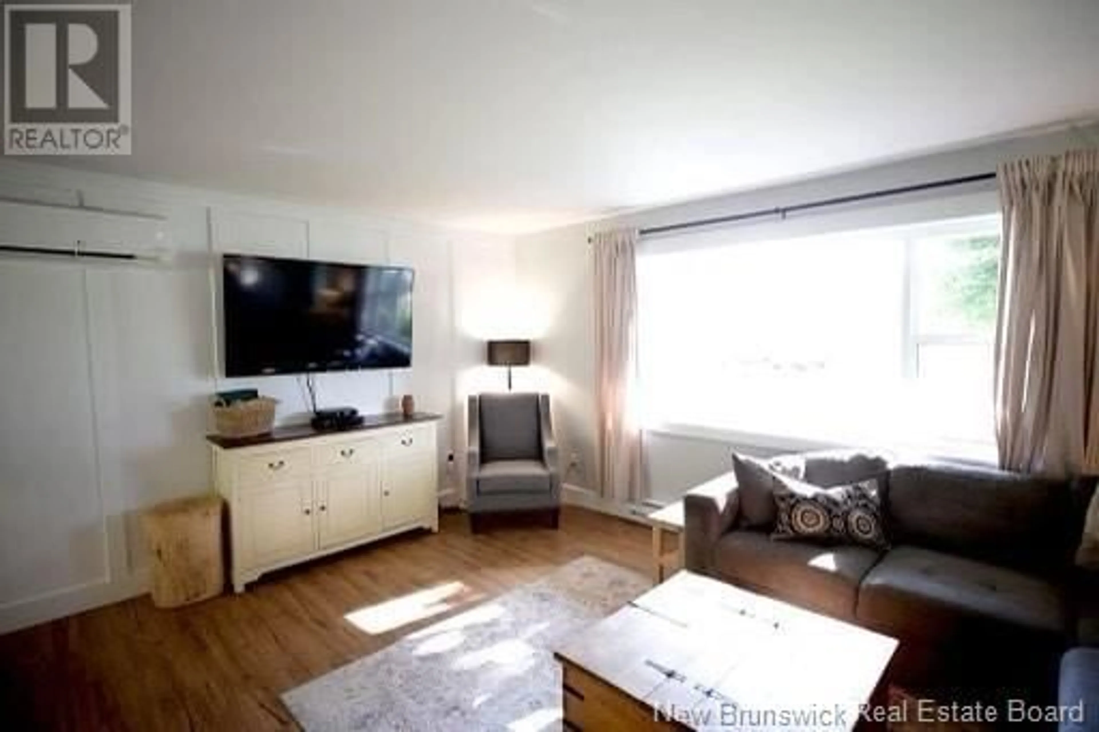 Living room with furniture, wood/laminate floor for 233 TOBIAS AVENUE, Riverview New Brunswick E1B4P6