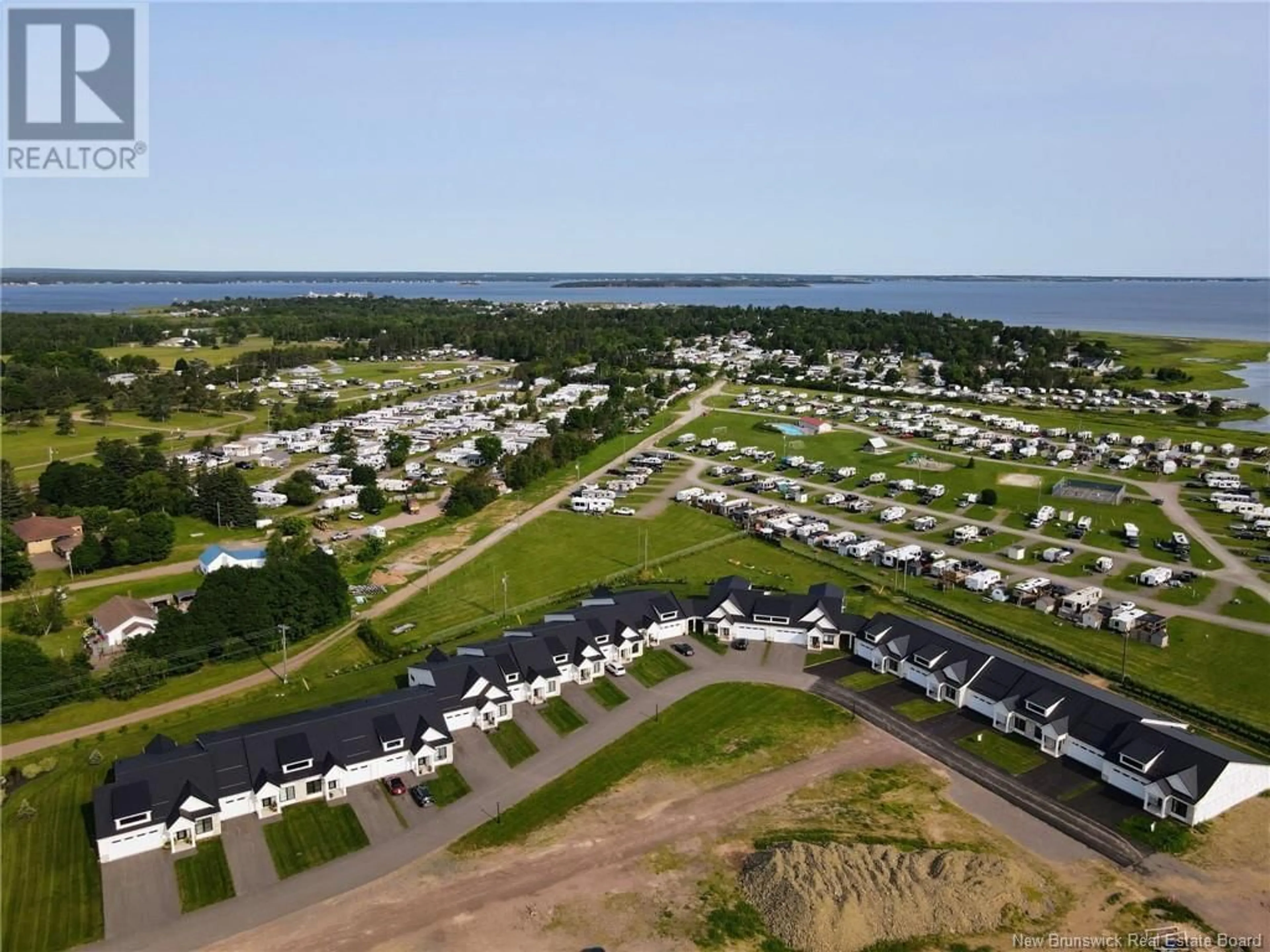 A pic from outside/outdoor area/front of a property/back of a property/a pic from drone, water/lake/river/ocean view for 116 - 724 ROUTE 133, Shediac New Brunswick E4P5A3
