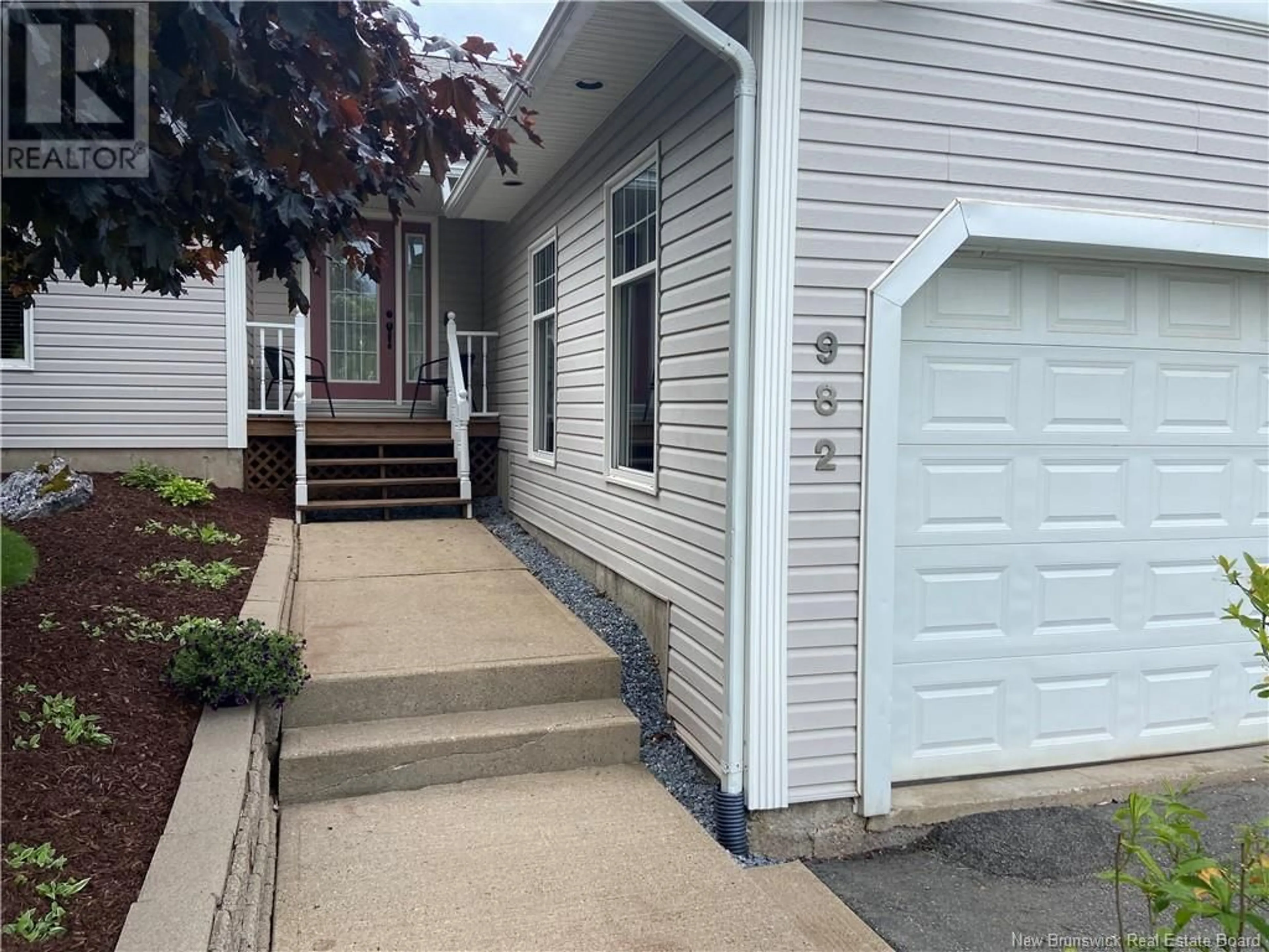 Home with vinyl exterior material, street for 982 KENNEBECASIS DRIVE, Saint John New Brunswick E2K5A9