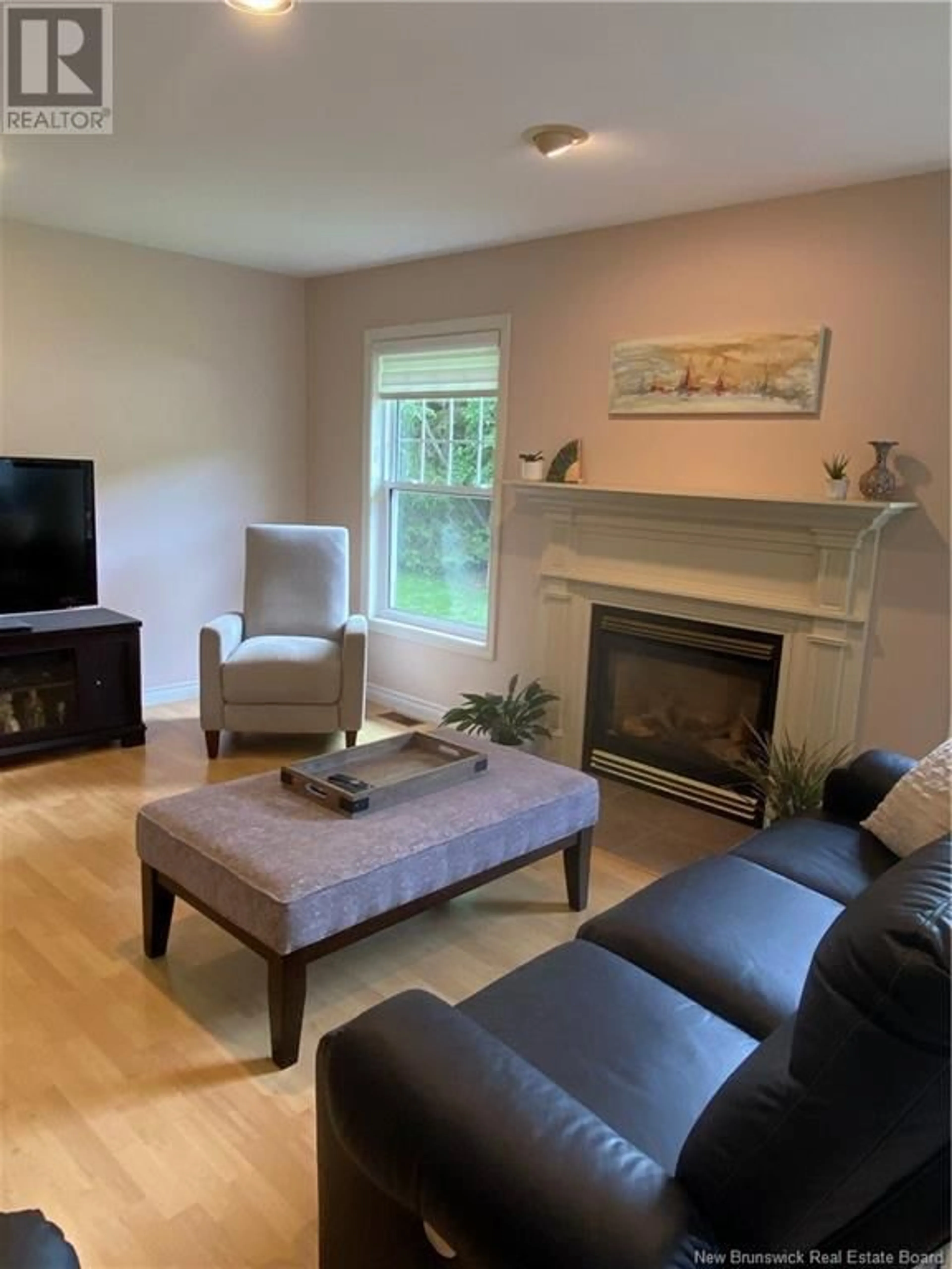 Living room with furniture, wood/laminate floor for 982 KENNEBECASIS DRIVE, Saint John New Brunswick E2K5A9