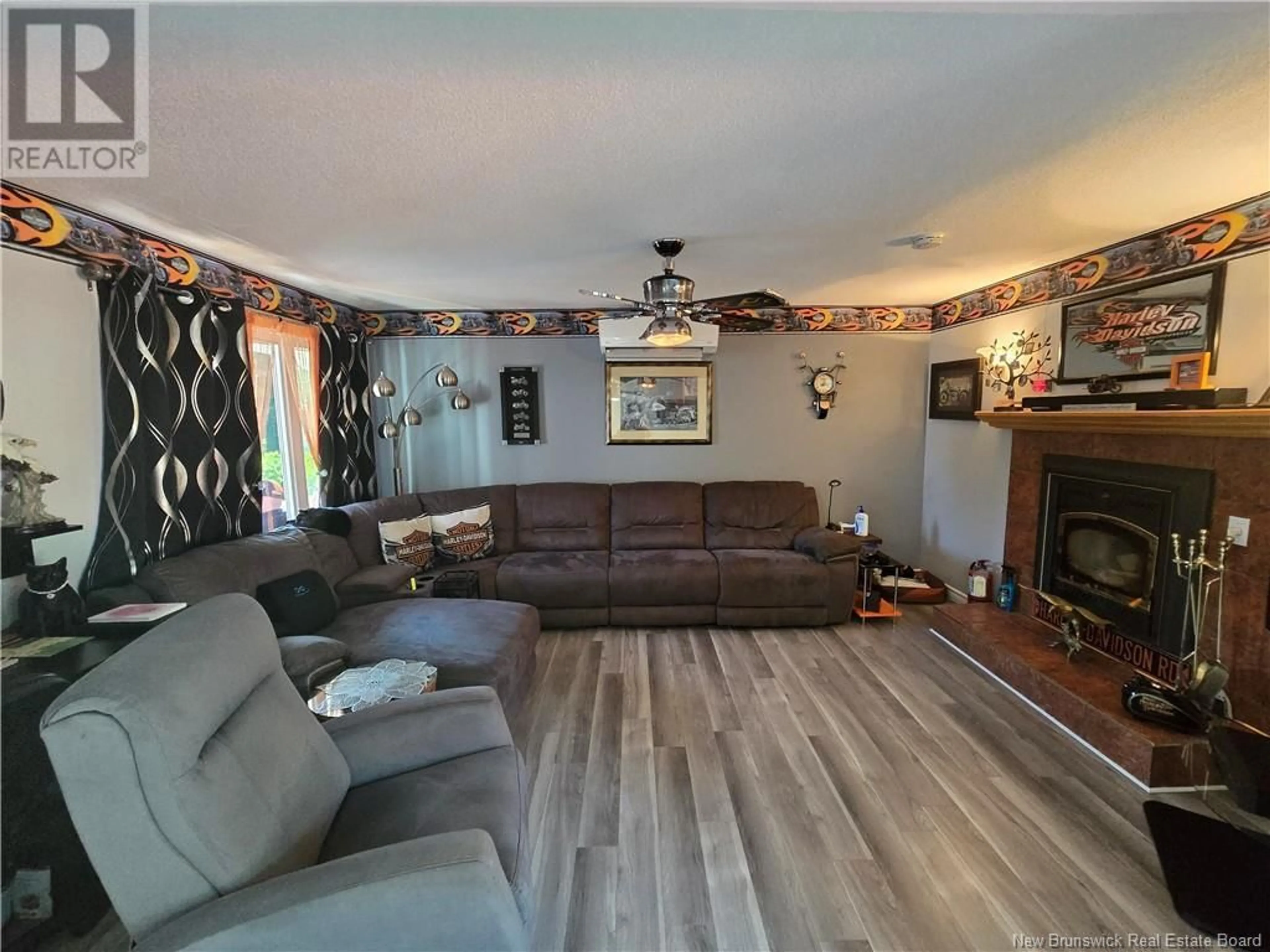 Living room with furniture, wood/laminate floor for 2052 MILLSTREAM ROAD, Dunlop New Brunswick E8K2K3