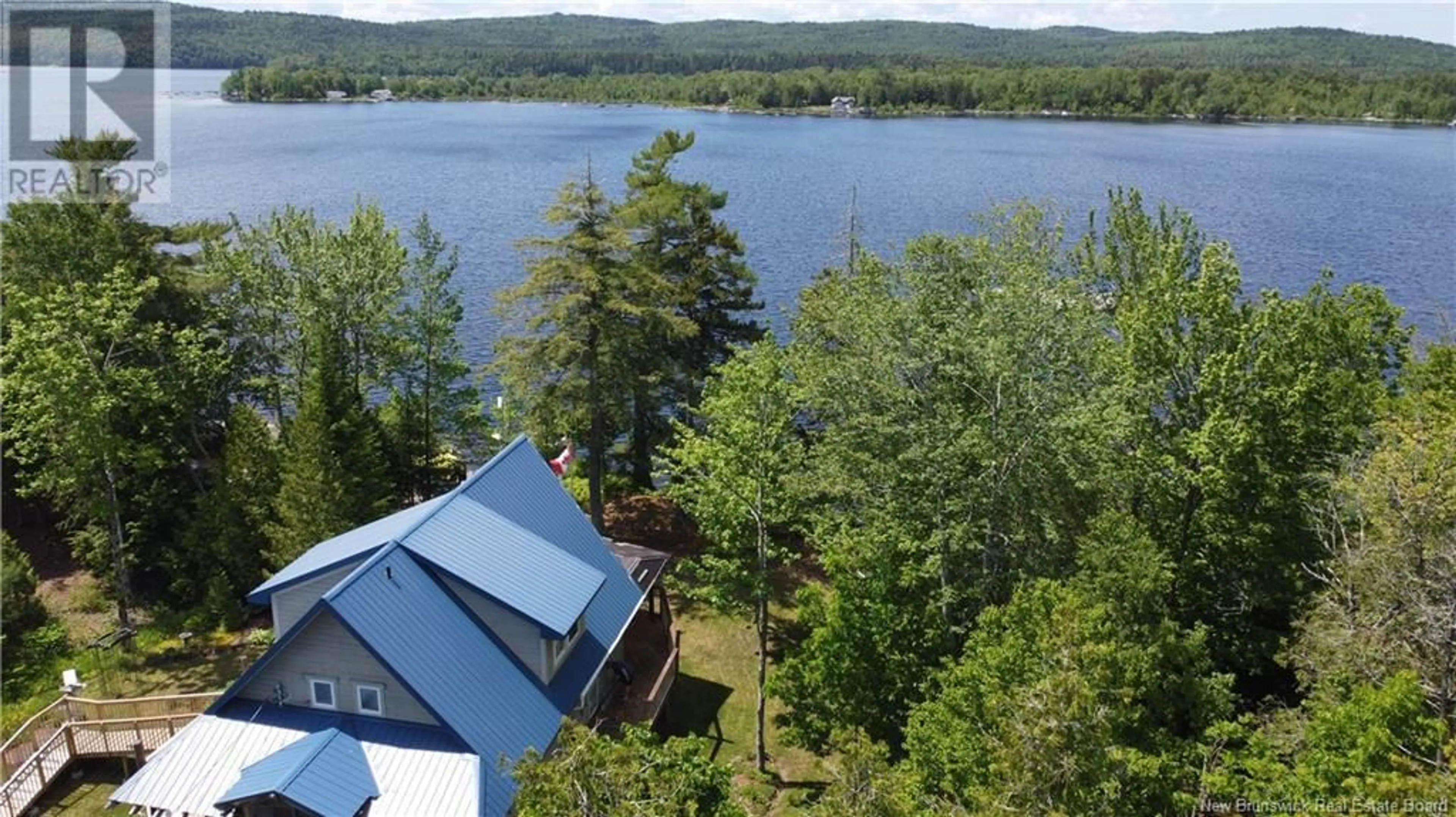 A pic from outside/outdoor area/front of a property/back of a property/a pic from drone, water/lake/river/ocean view for 19 DELONG LANE, Eel River Lake New Brunswick E6H0B5