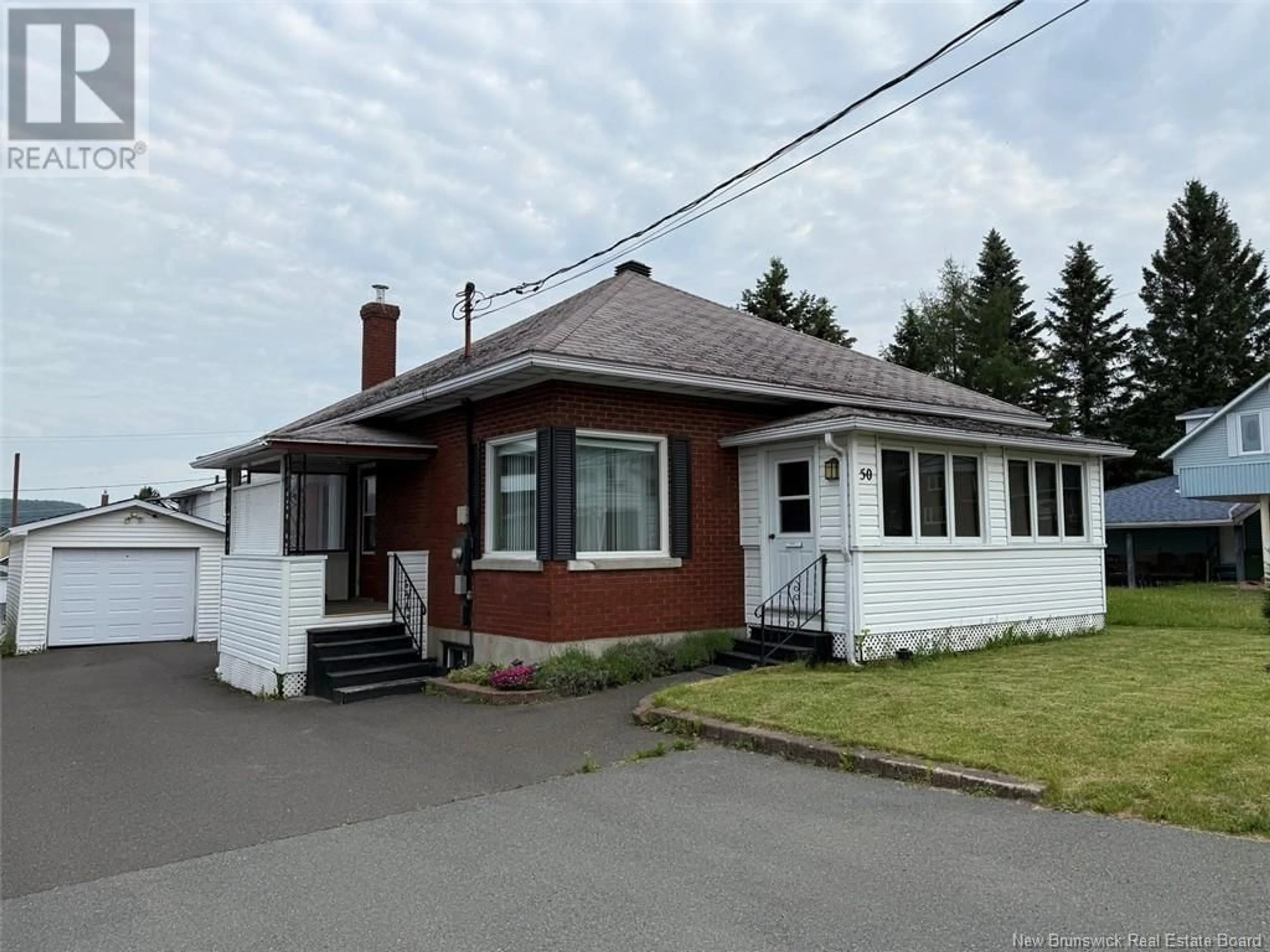 Home with vinyl exterior material, street for 50 34TH AVENUE, Edmundston New Brunswick E3V2T2