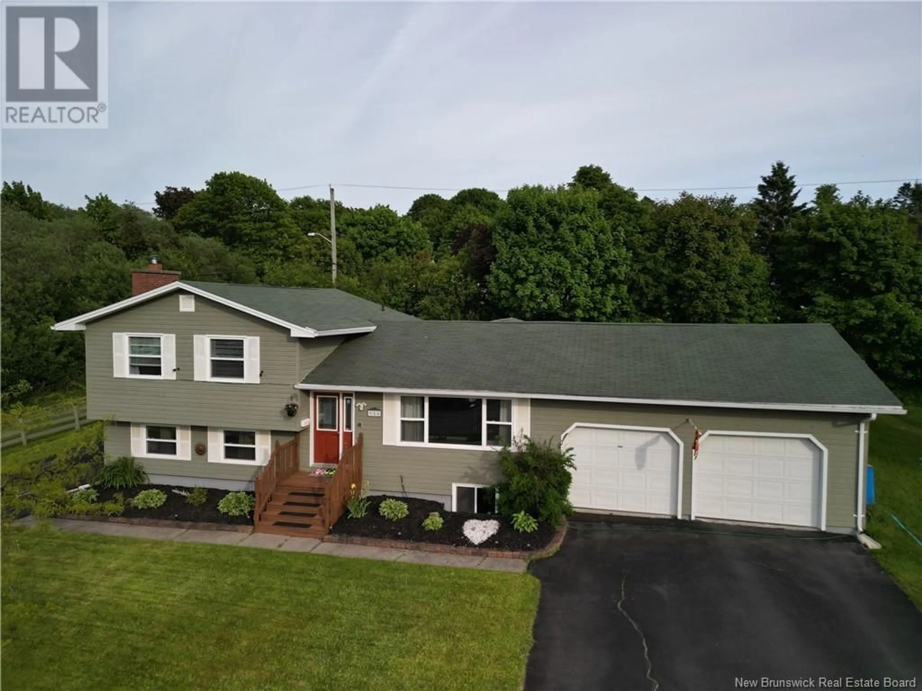 A pic from outside/outdoor area/front of a property/back of a property/a pic from drone, street for 950 MOLLINS DRIVE, Saint John New Brunswick E2M4L8