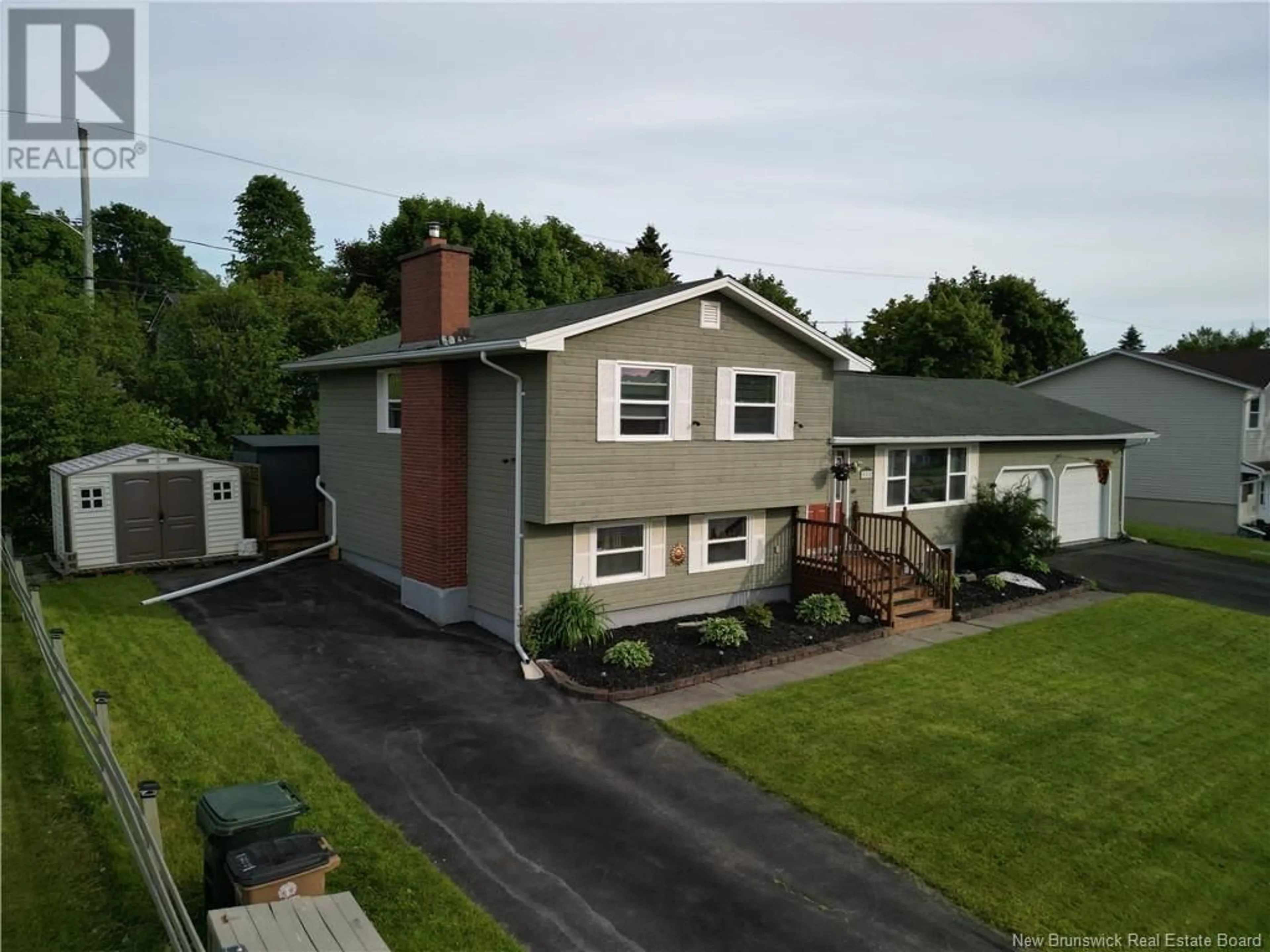 A pic from outside/outdoor area/front of a property/back of a property/a pic from drone, street for 950 MOLLINS DRIVE, Saint John New Brunswick E2M4L8