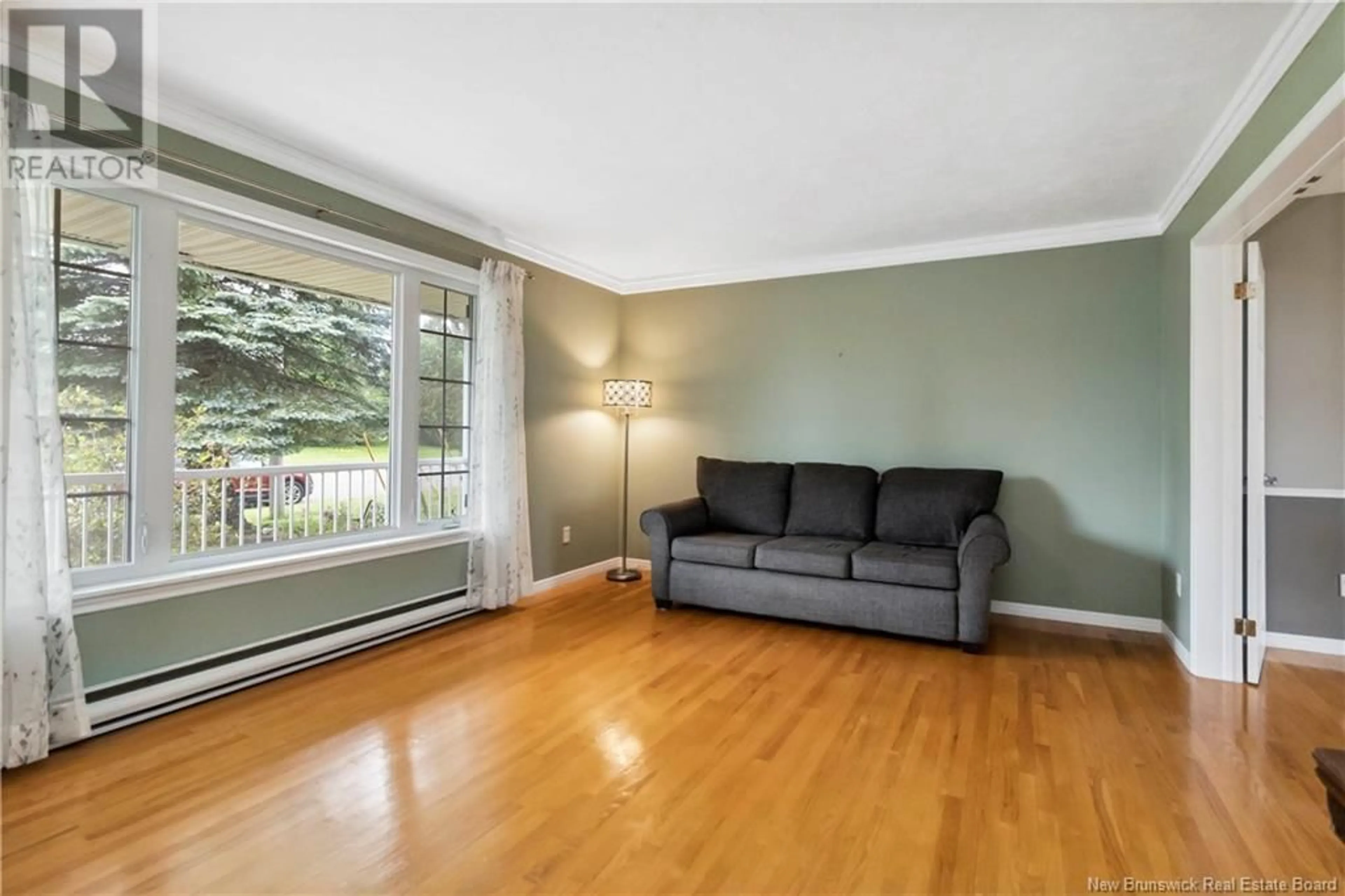 Living room with furniture, wood/laminate floor for 320 THIBODEAU STREET, Dieppe New Brunswick E1A1W2