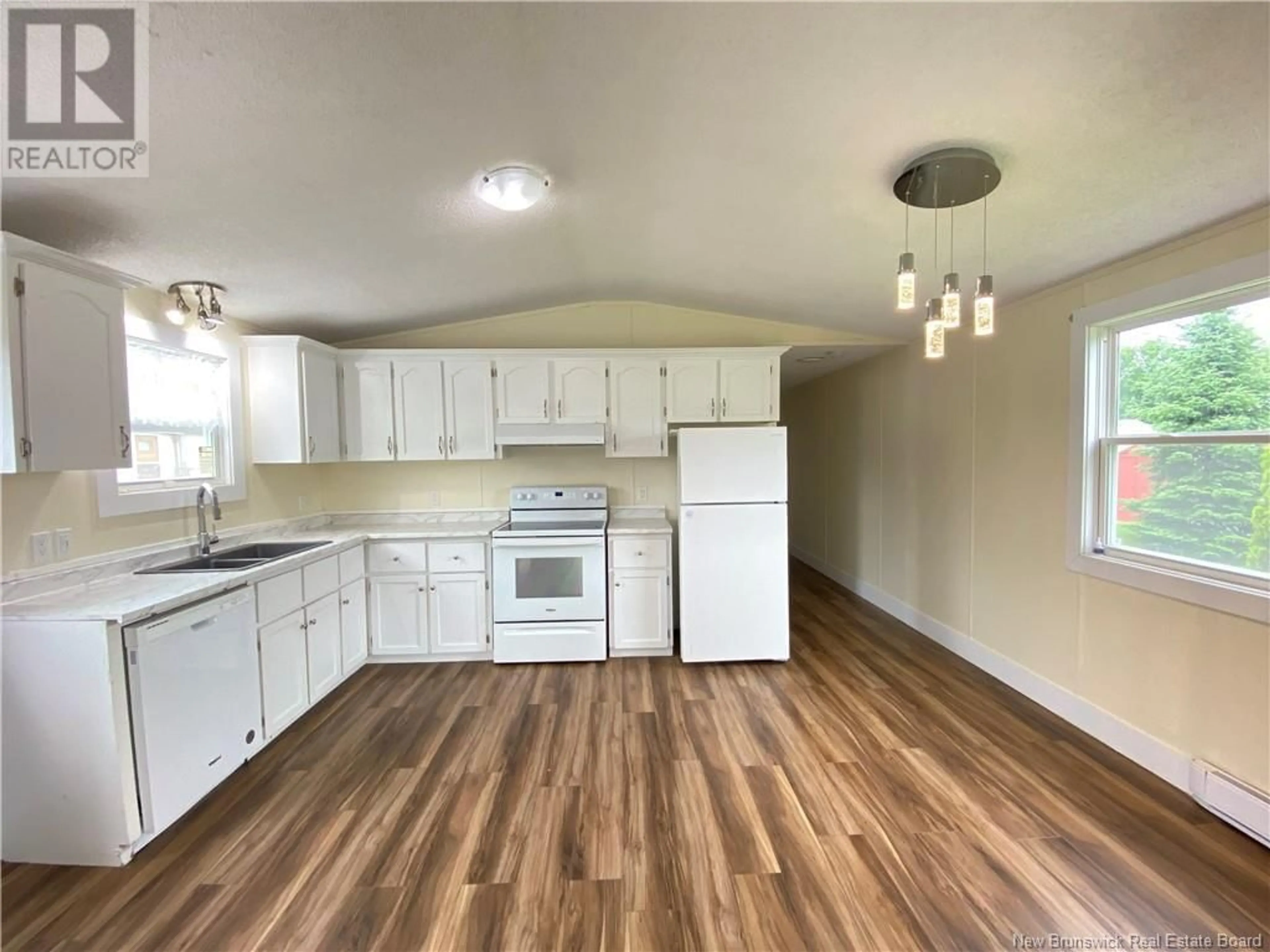 Open concept kitchen, wood/laminate floor for 10 HEDGEVIEW DRIVE, Hanwell New Brunswick E3B6S1