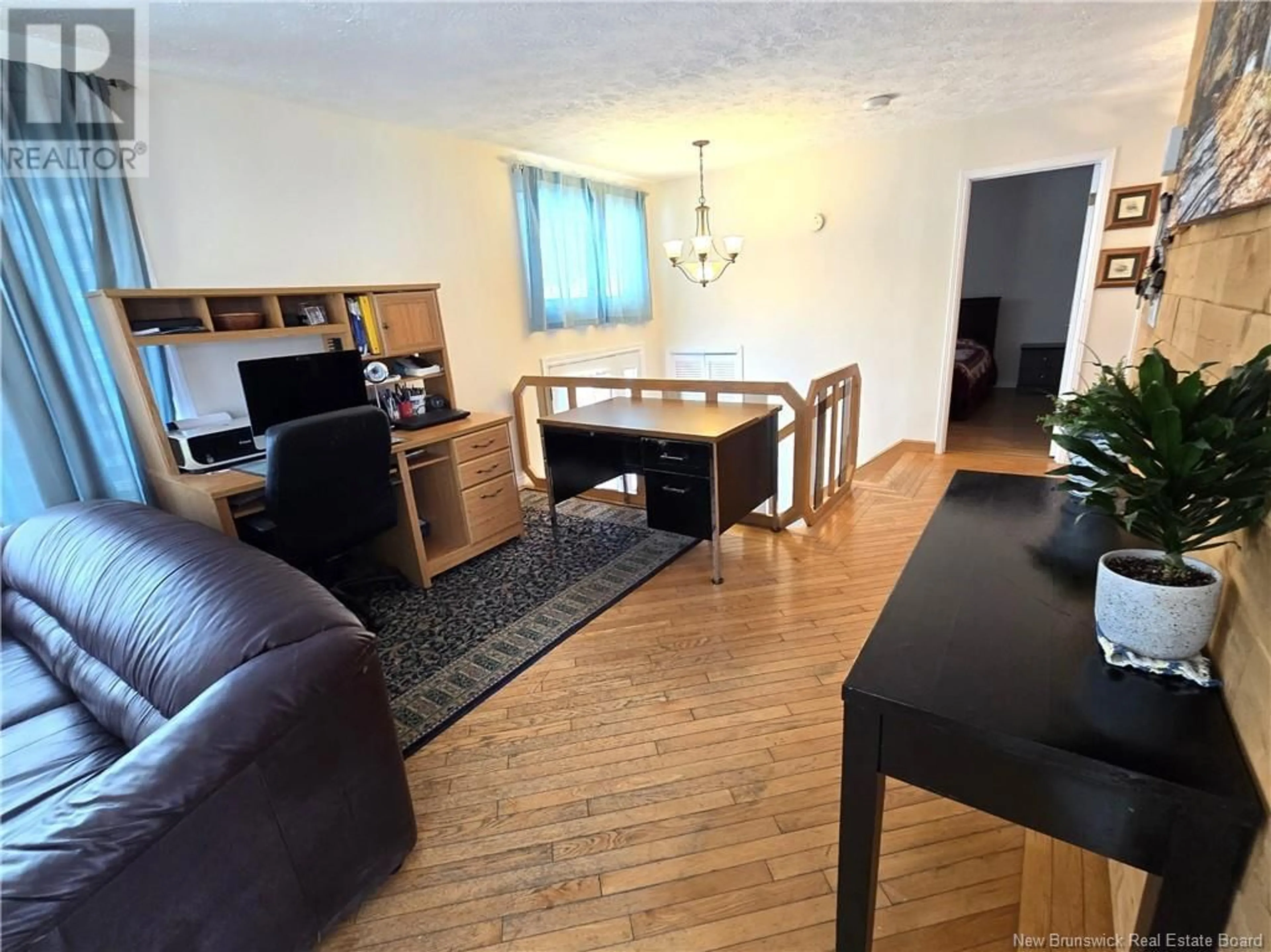 Living room with furniture, wood/laminate floor for 2074 COMMERCIALE STREET, Saint-François-de-Madawaska New Brunswick E7A1B2