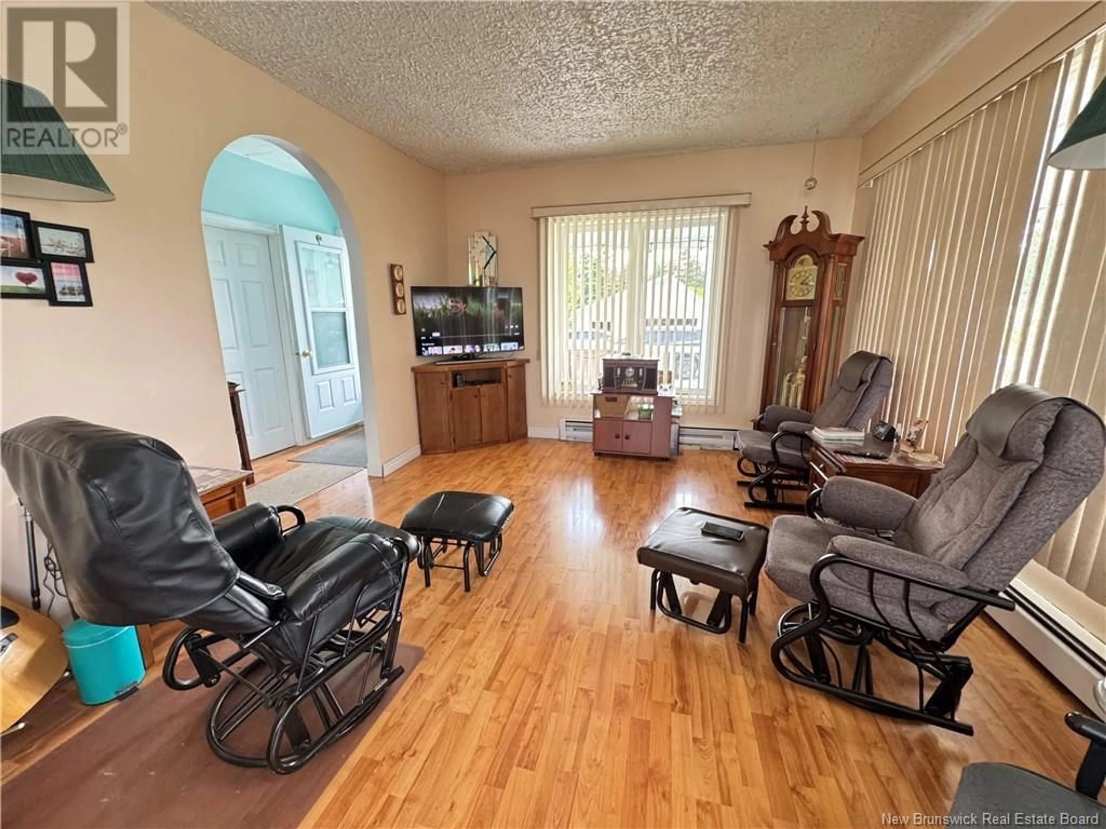 Living room with furniture, wood/laminate floor for 82 265 ROUTE, Kedgwick River New Brunswick E8B1R3
