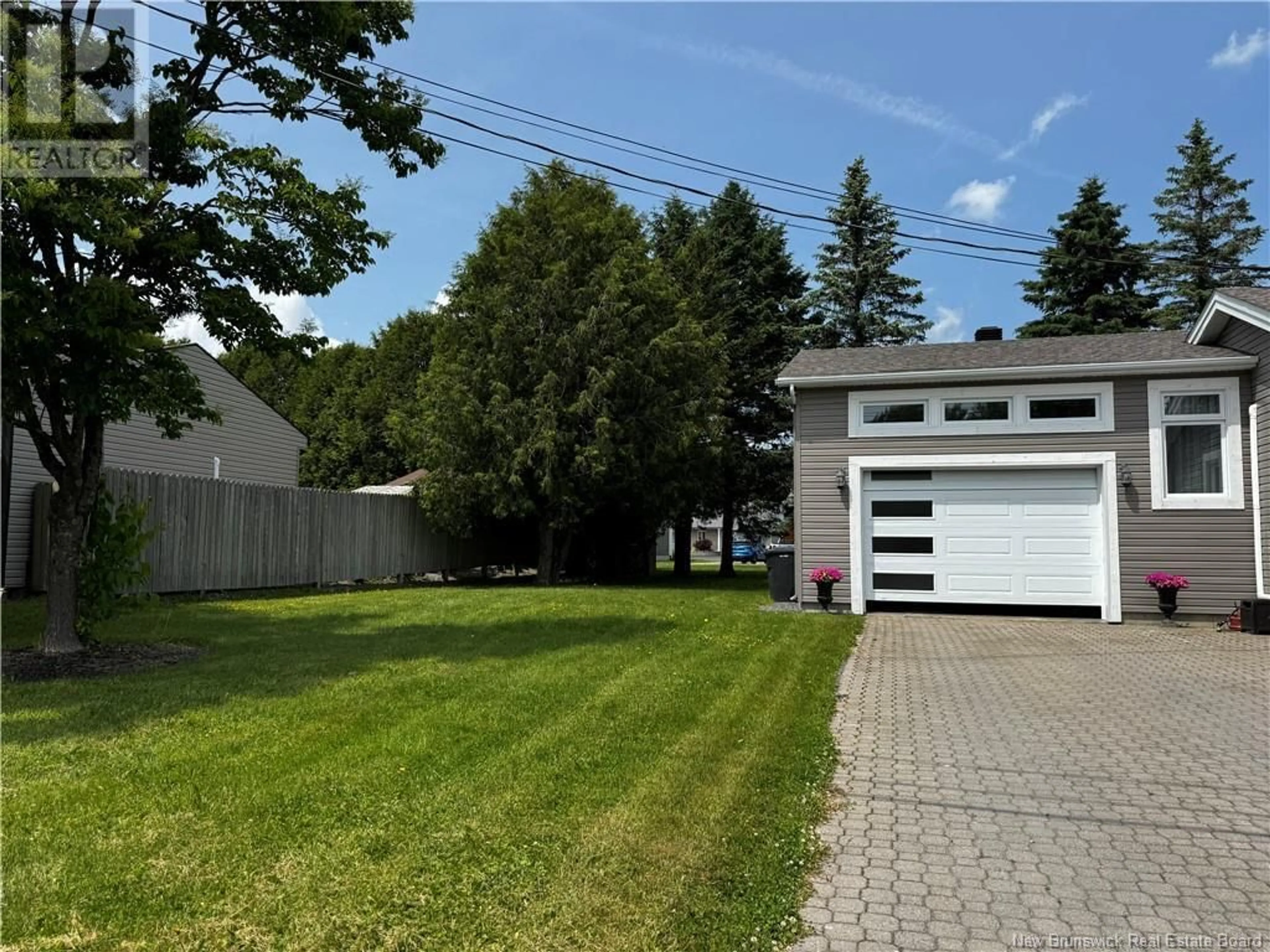 A pic from outside/outdoor area/front of a property/back of a property/a pic from drone, street for 33 BOSSÉ AVENUE, Edmundston New Brunswick E3V3Z8