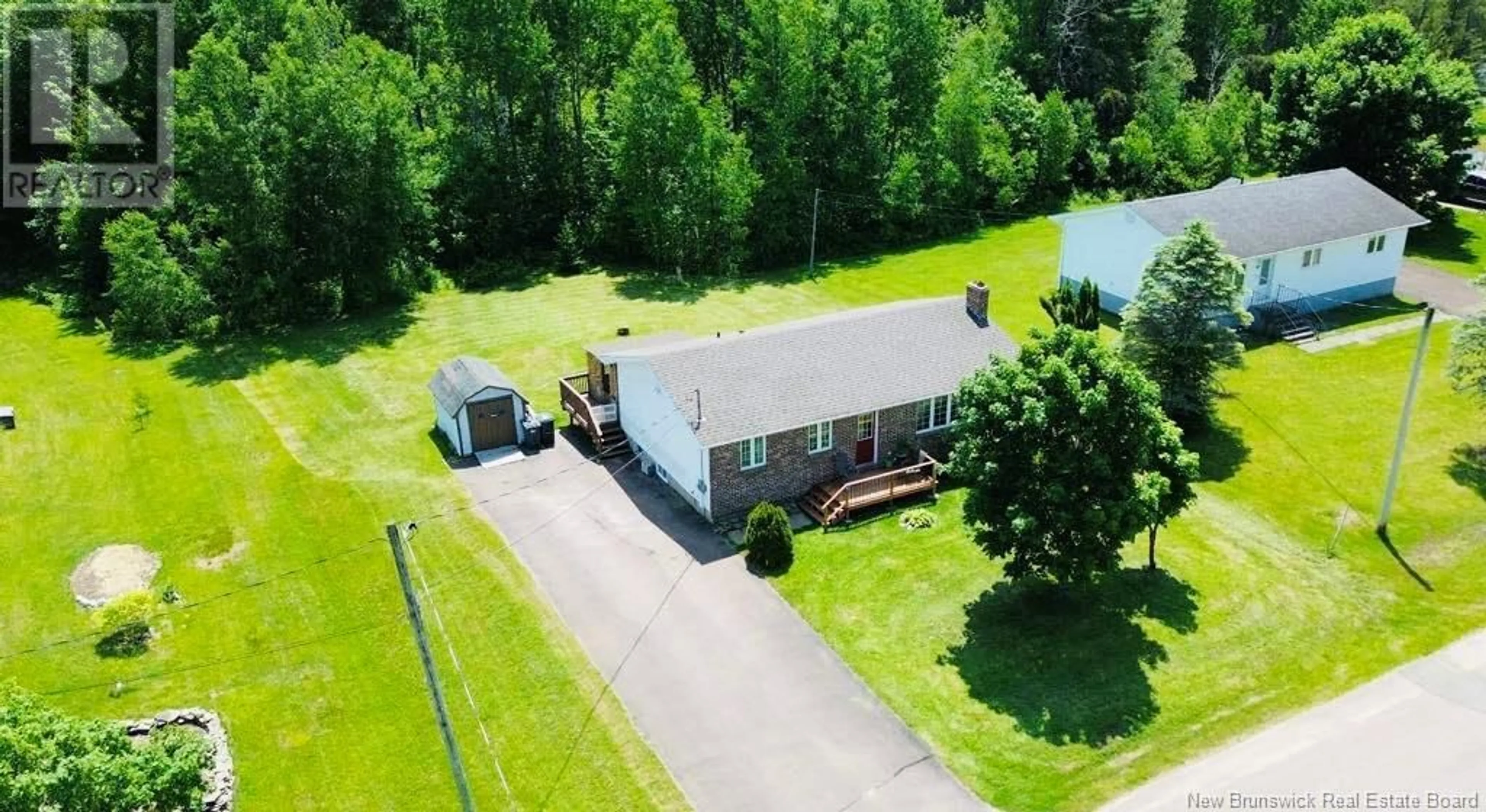 A pic from outside/outdoor area/front of a property/back of a property/a pic from drone, unknown for 92 RUE ST PATRICK STREET, Rogersville New Brunswick E4Y2H4