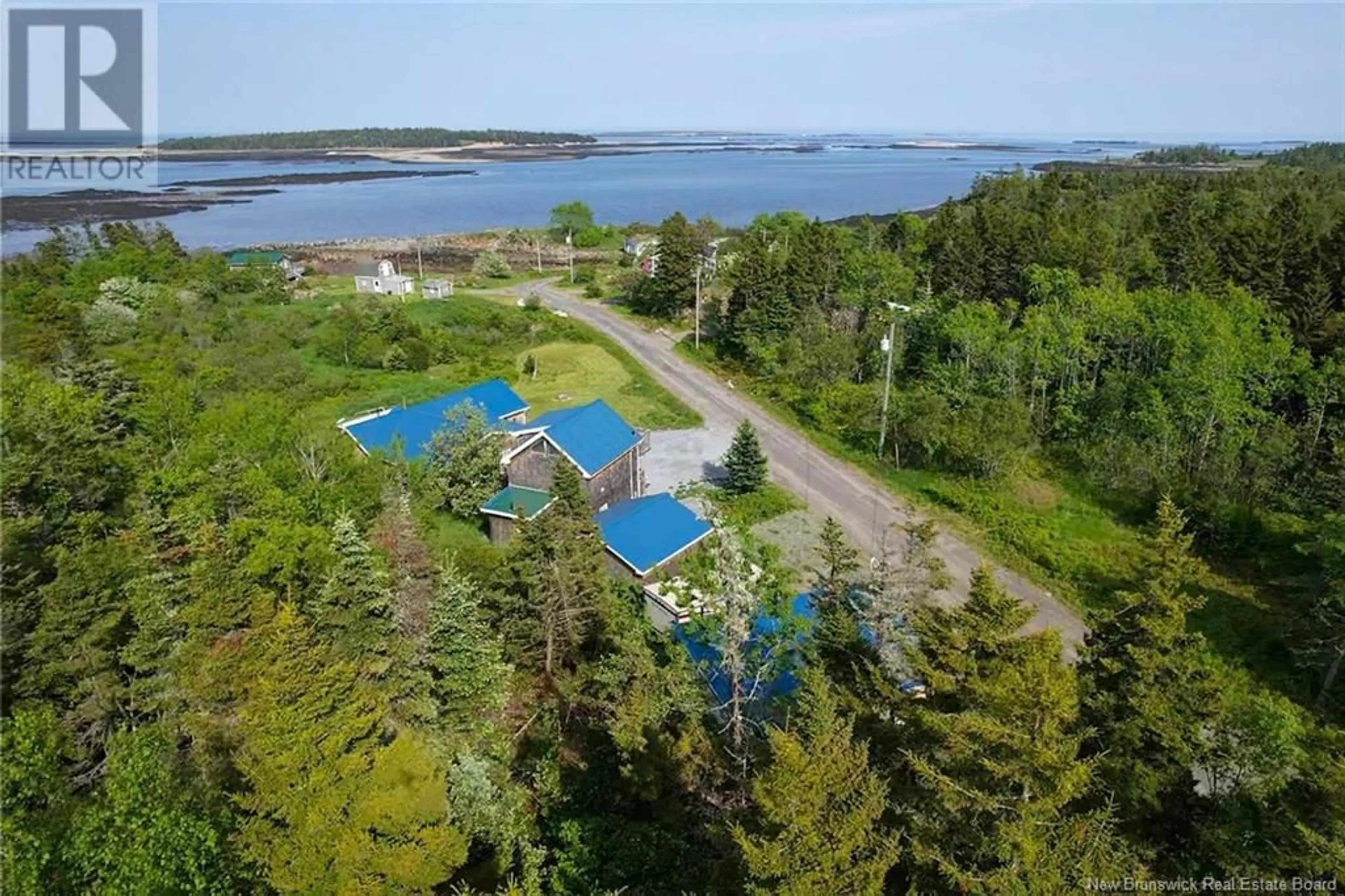 A pic from outside/outdoor area/front of a property/back of a property/a pic from drone, water/lake/river/ocean view for 11 COOK ROAD, Grand Manan New Brunswick E5G4E3
