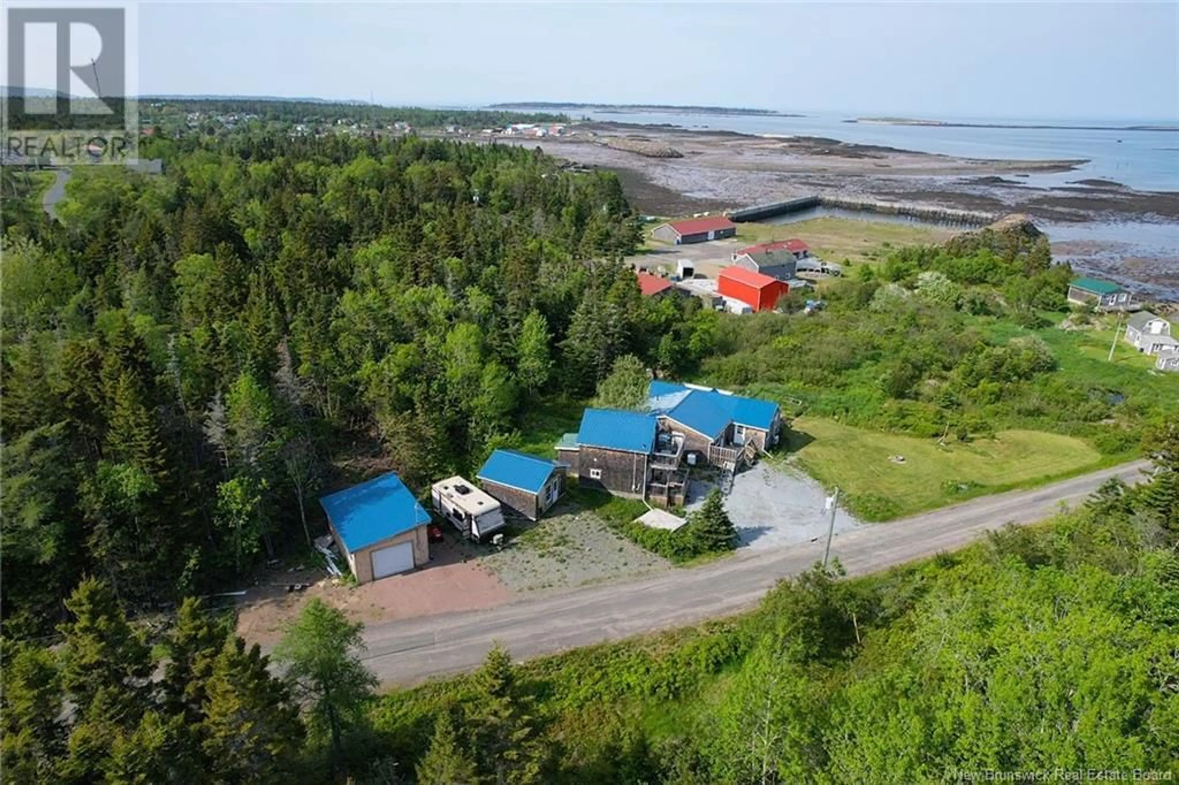 A pic from outside/outdoor area/front of a property/back of a property/a pic from drone, water/lake/river/ocean view for 11 COOK ROAD, Grand Manan New Brunswick E5G4E3