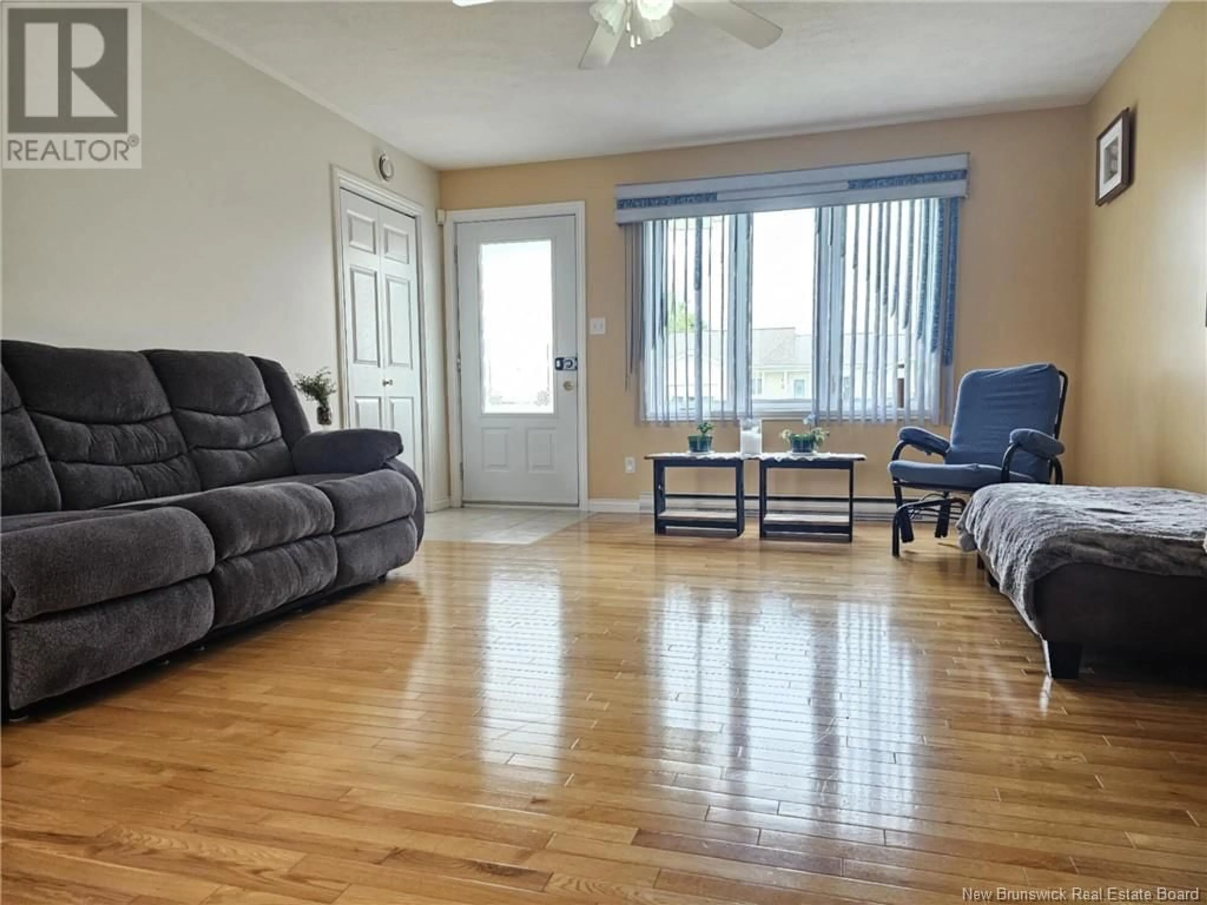 Living room with furniture, wood/laminate floor for 86 MOCKLER STREET, Grand Falls New Brunswick E3Y1A6