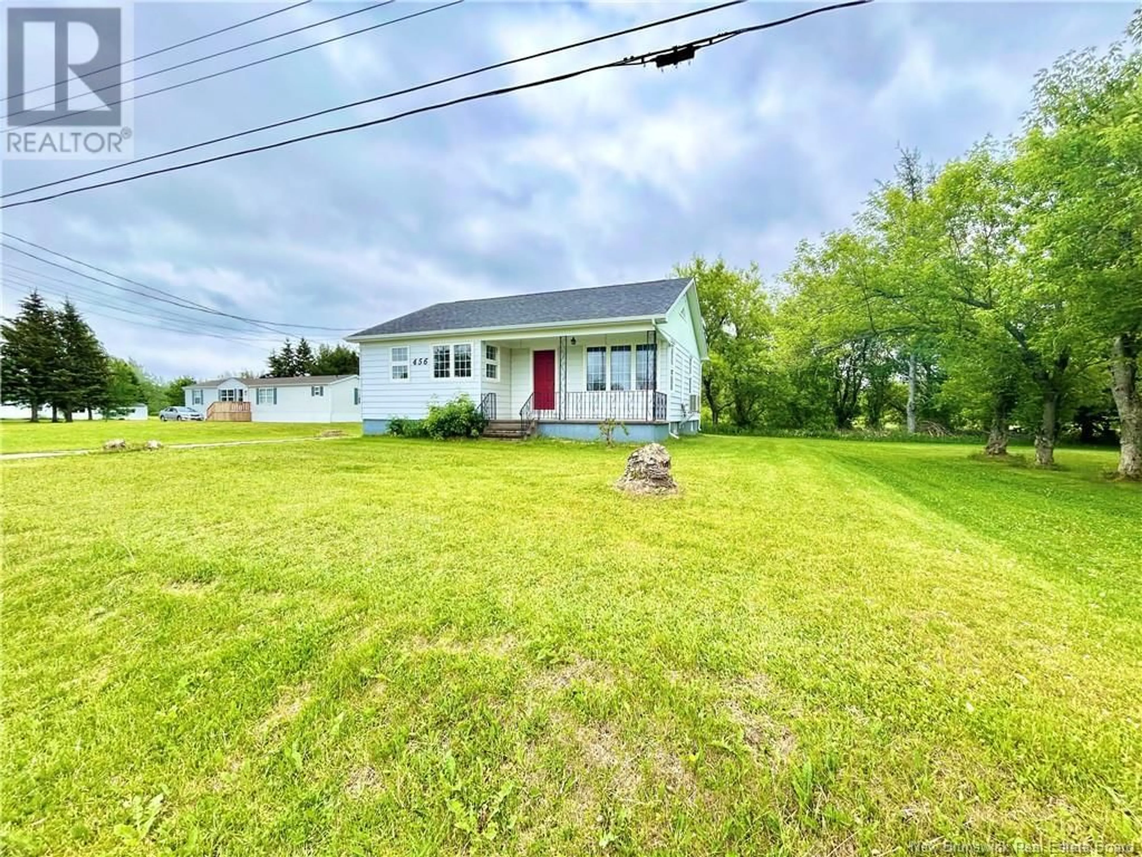 A pic from outside/outdoor area/front of a property/back of a property/a pic from drone, street for 456 HAUT-ST-SIMON, Saint-Simon New Brunswick E8P1Y9