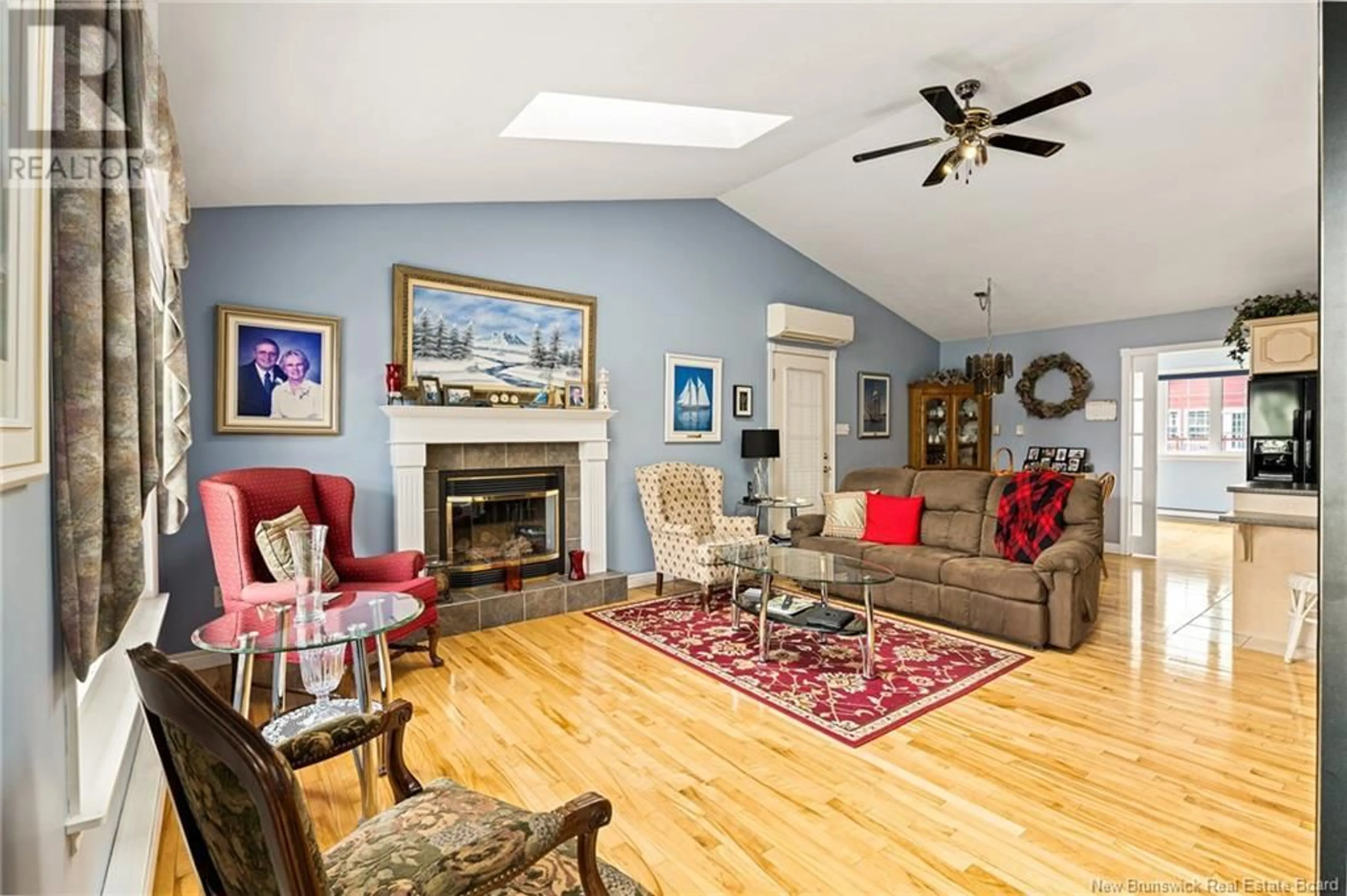 Living room with furniture, wood/laminate floor for 99 LA BATTURE STREET, Shediac New Brunswick E4P1Y1