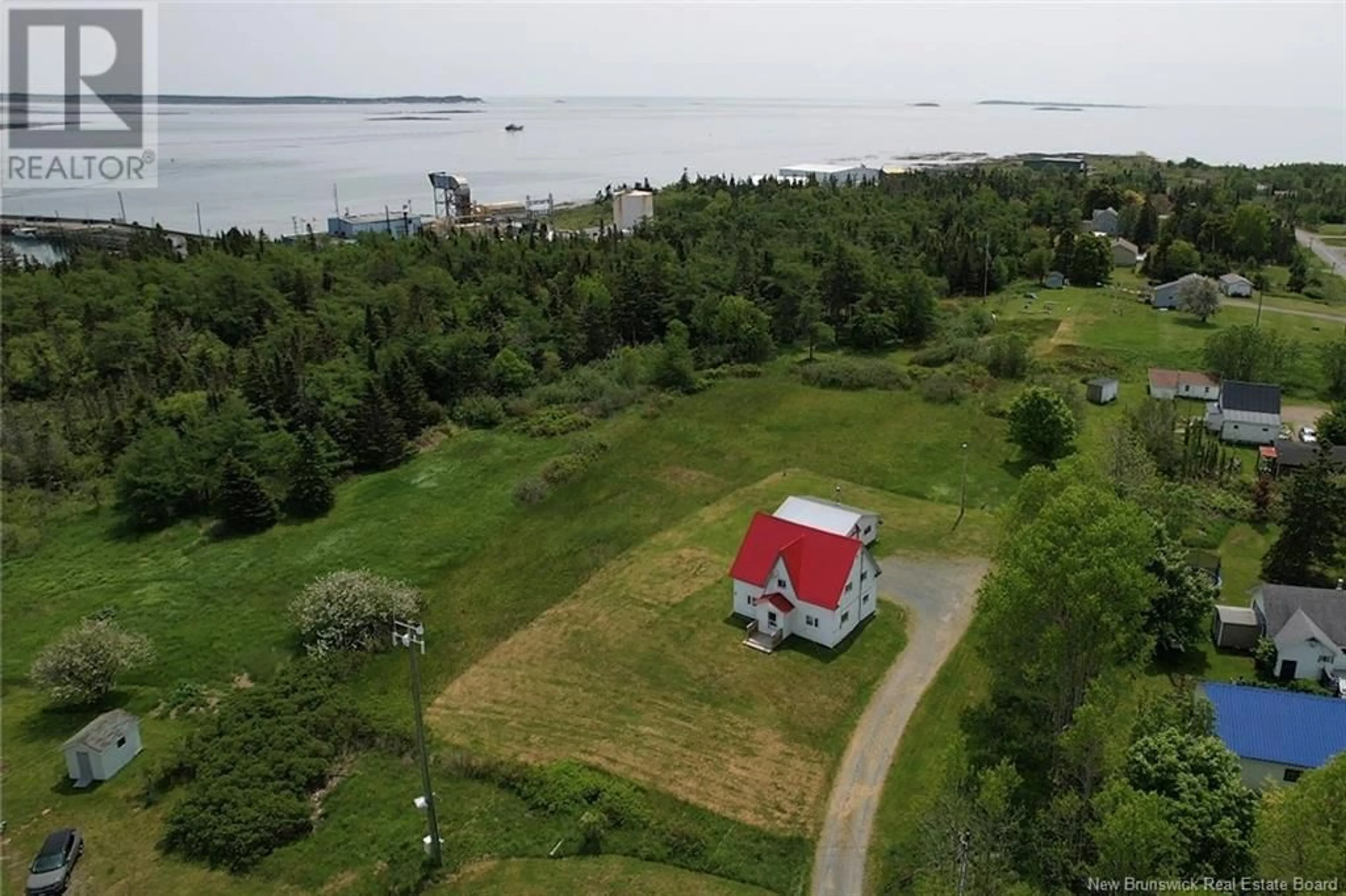 A pic from outside/outdoor area/front of a property/back of a property/a pic from drone, water/lake/river/ocean view for 11 CHESTER DRIVE, Grand Manan New Brunswick E5G4G5