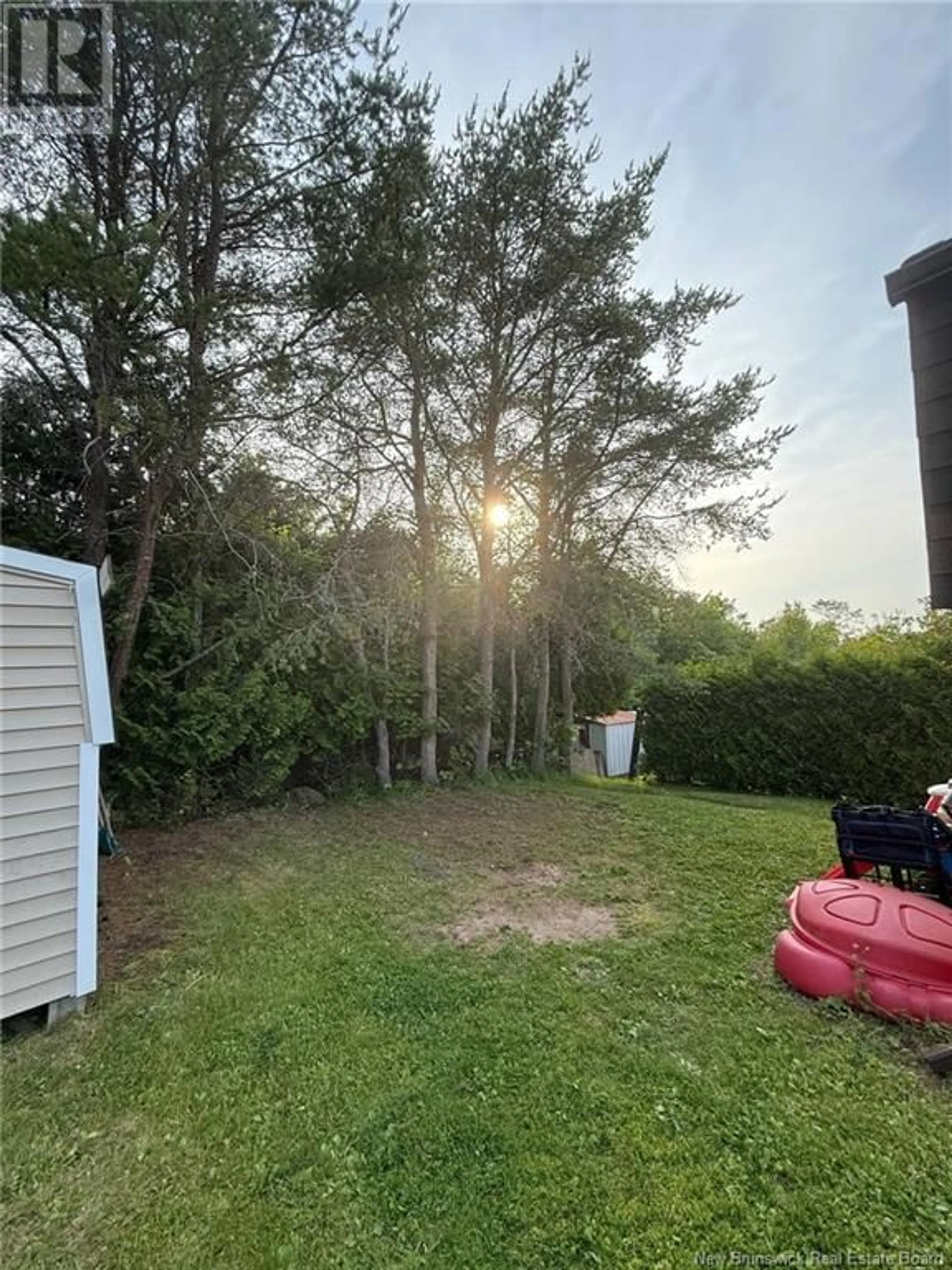 A pic from outside/outdoor area/front of a property/back of a property/a pic from drone, forest/trees view for 18 SIXTH STREET, Quispamsis New Brunswick E2G1W3