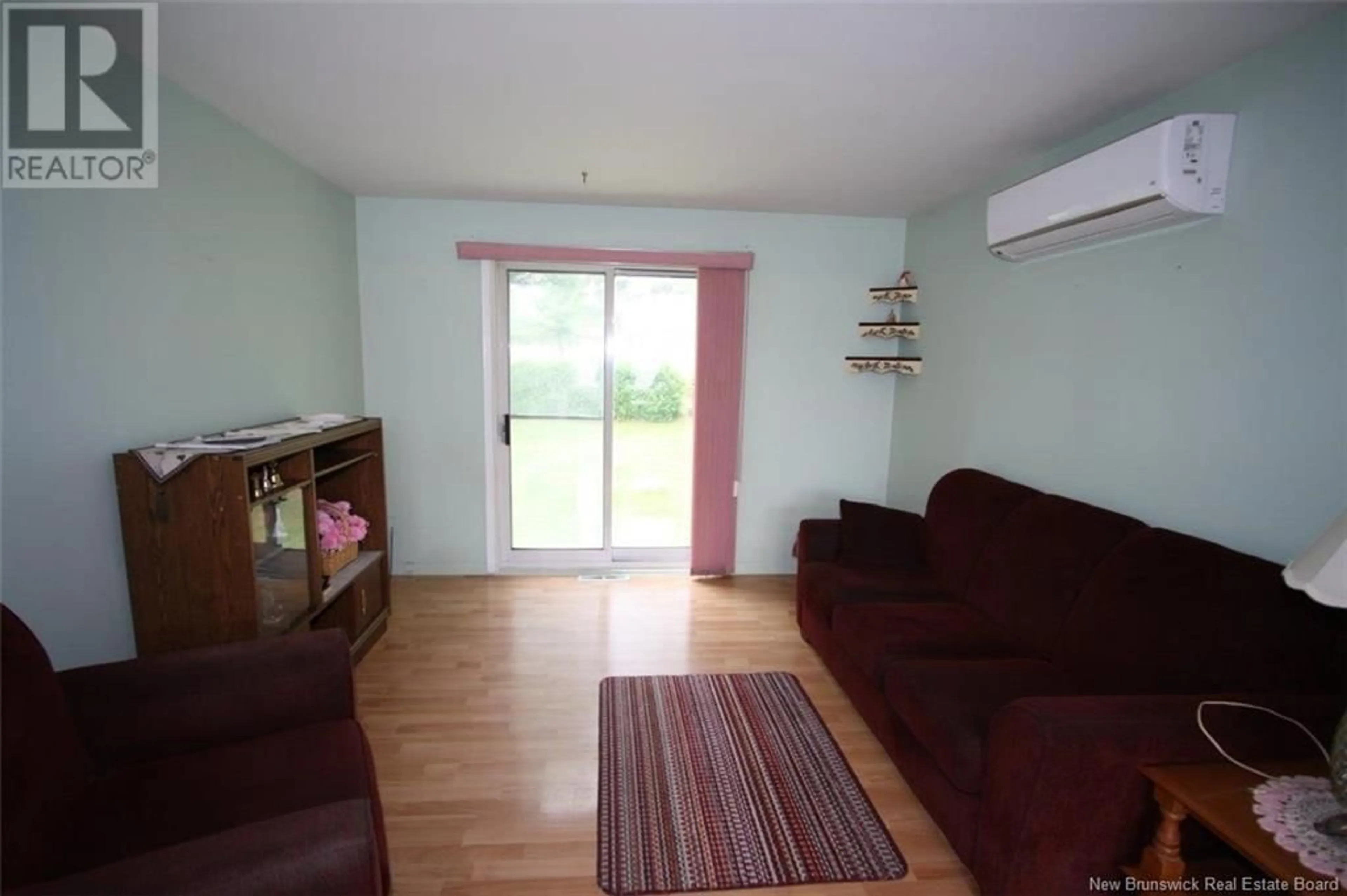 Living room with furniture, wood/laminate floor for 556 EMBLEM COURT, Oromocto New Brunswick E3V1H7