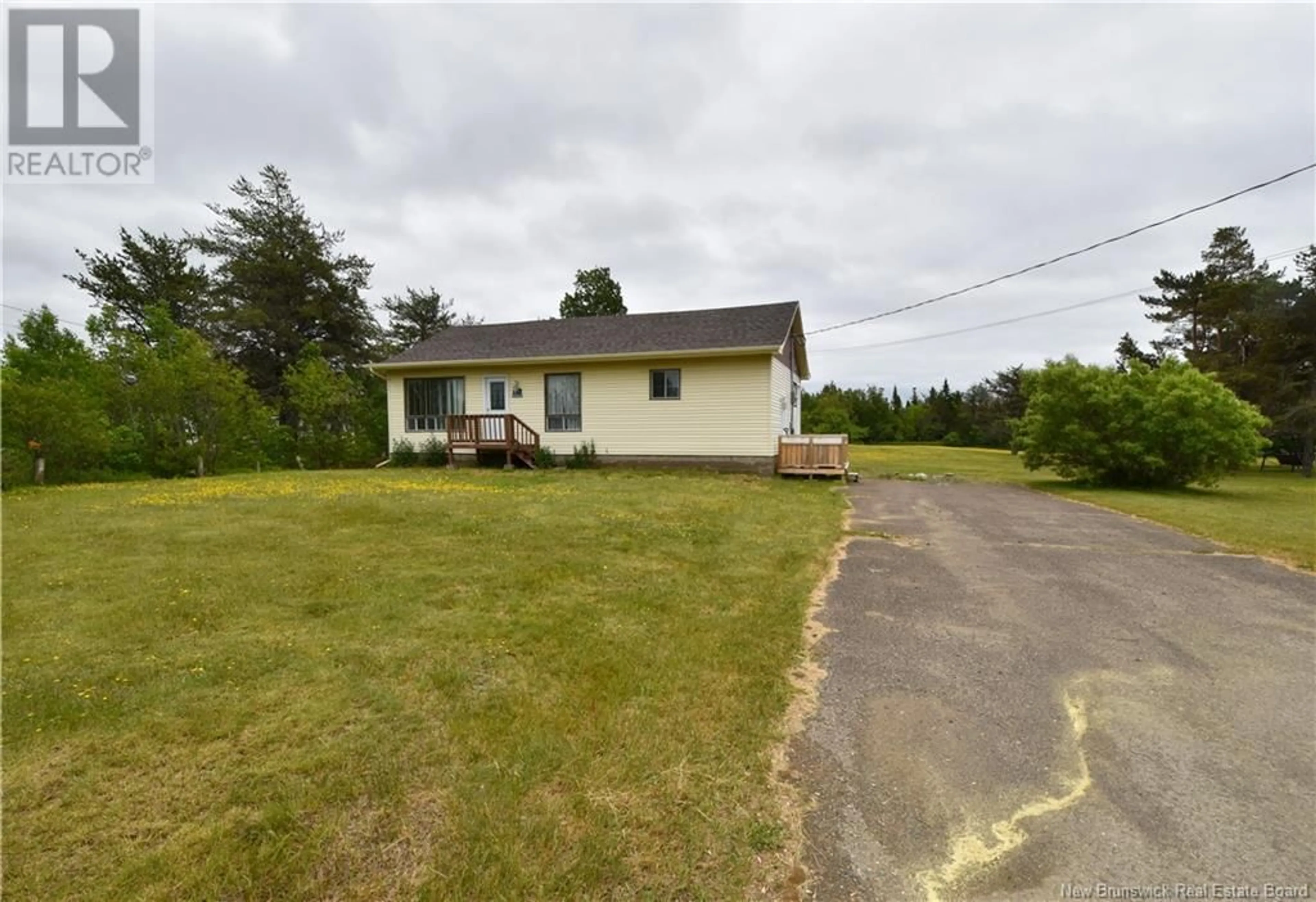 A pic from outside/outdoor area/front of a property/back of a property/a pic from drone, street for 5062 ROUTE 11, Brantville New Brunswick E9H1N1