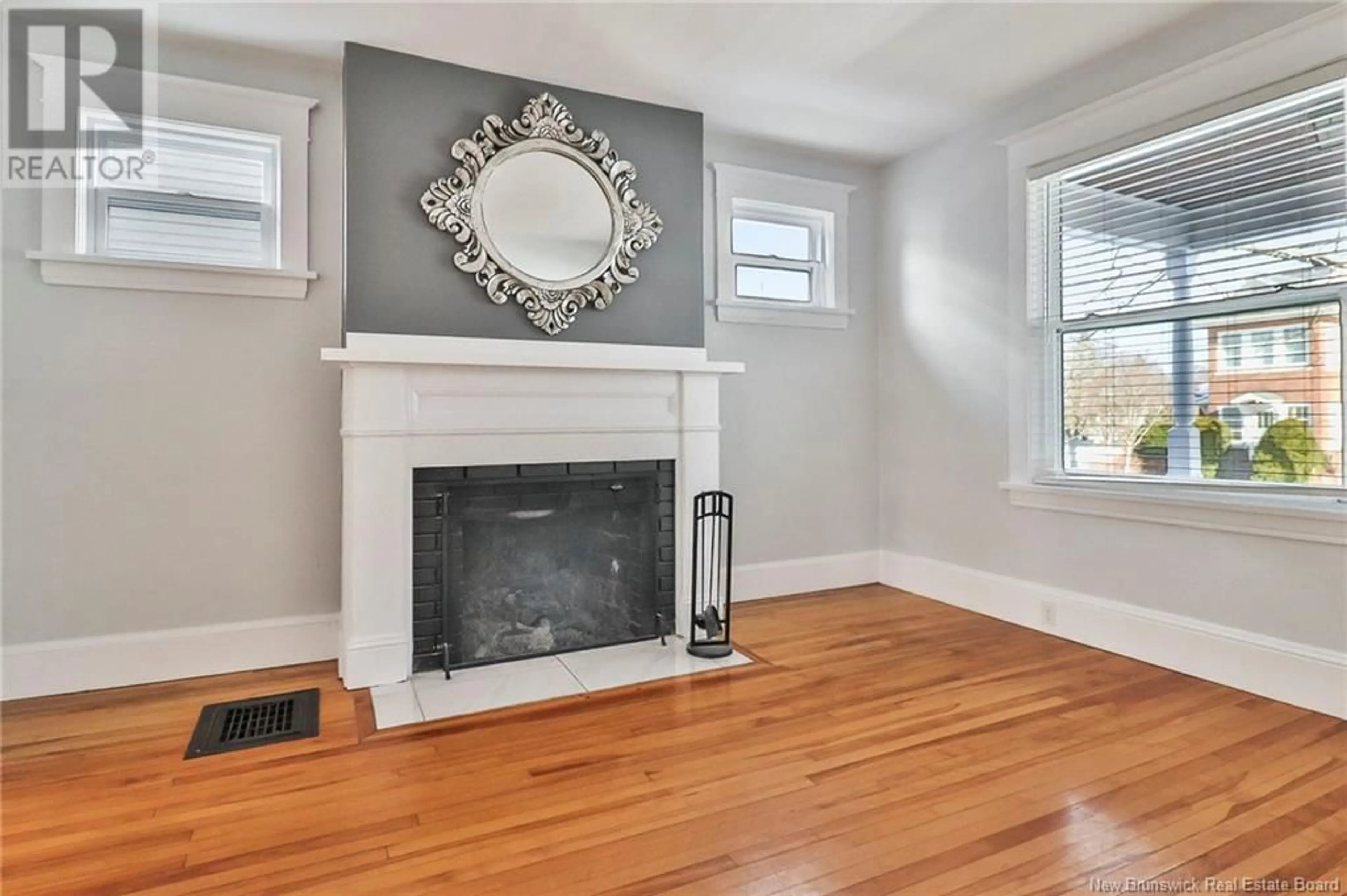 Living room with furniture, wood/laminate floor for 46-48 BROMLEY, Moncton New Brunswick E1C5T9