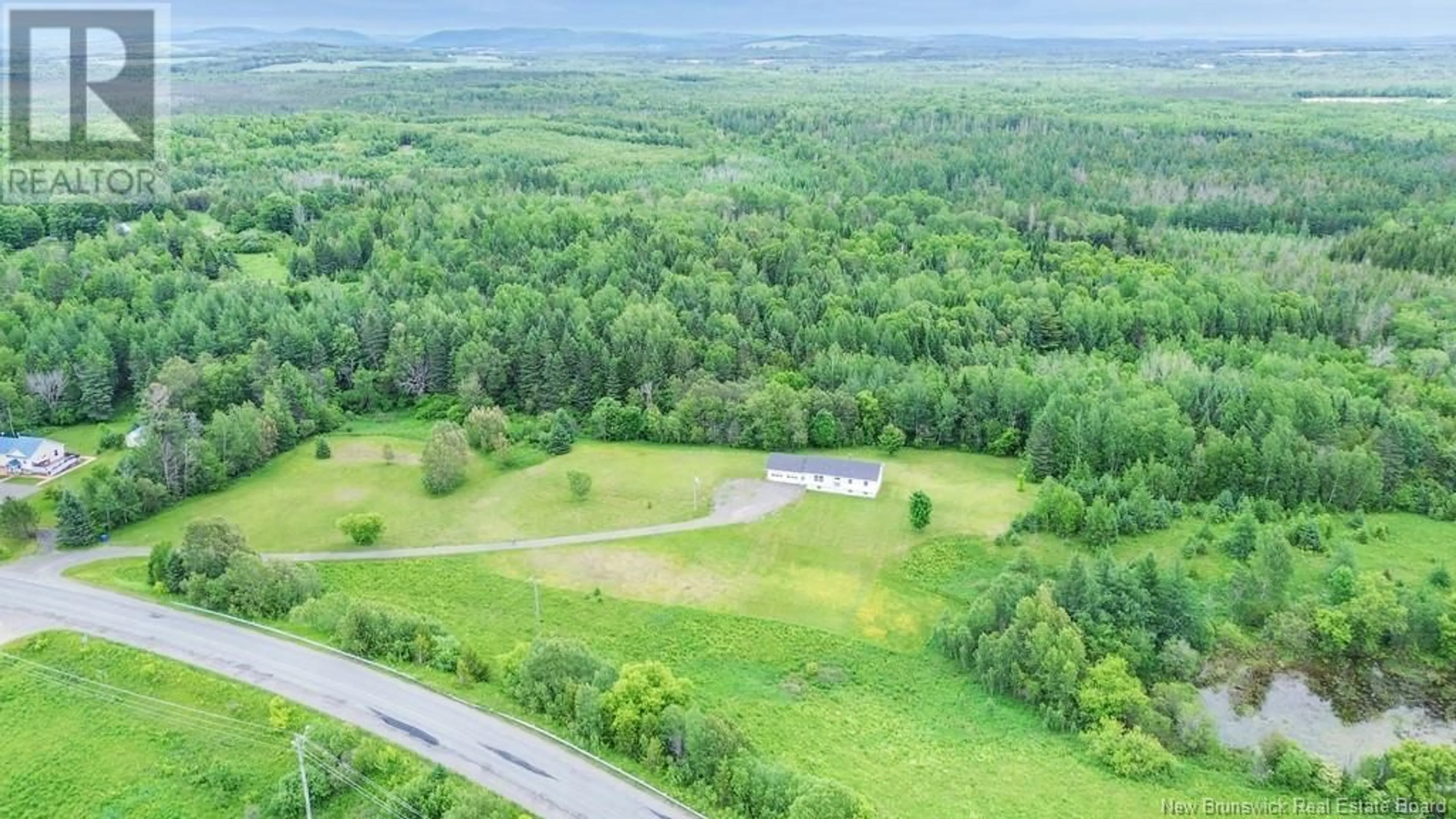 A pic from outside/outdoor area/front of a property/back of a property/a pic from drone, forest/trees view for 2280 560 ROUTE ROUTE, Lakeville New Brunswick E7K1T6