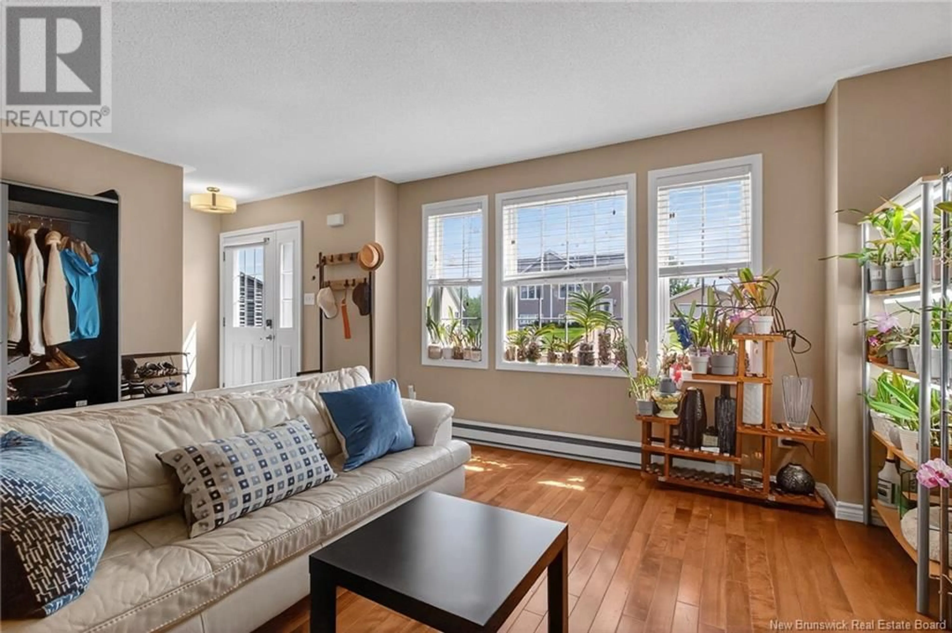 Living room with furniture, wood/laminate floor for 28 GAGNON DRIVE, Moncton New Brunswick E1A0A5