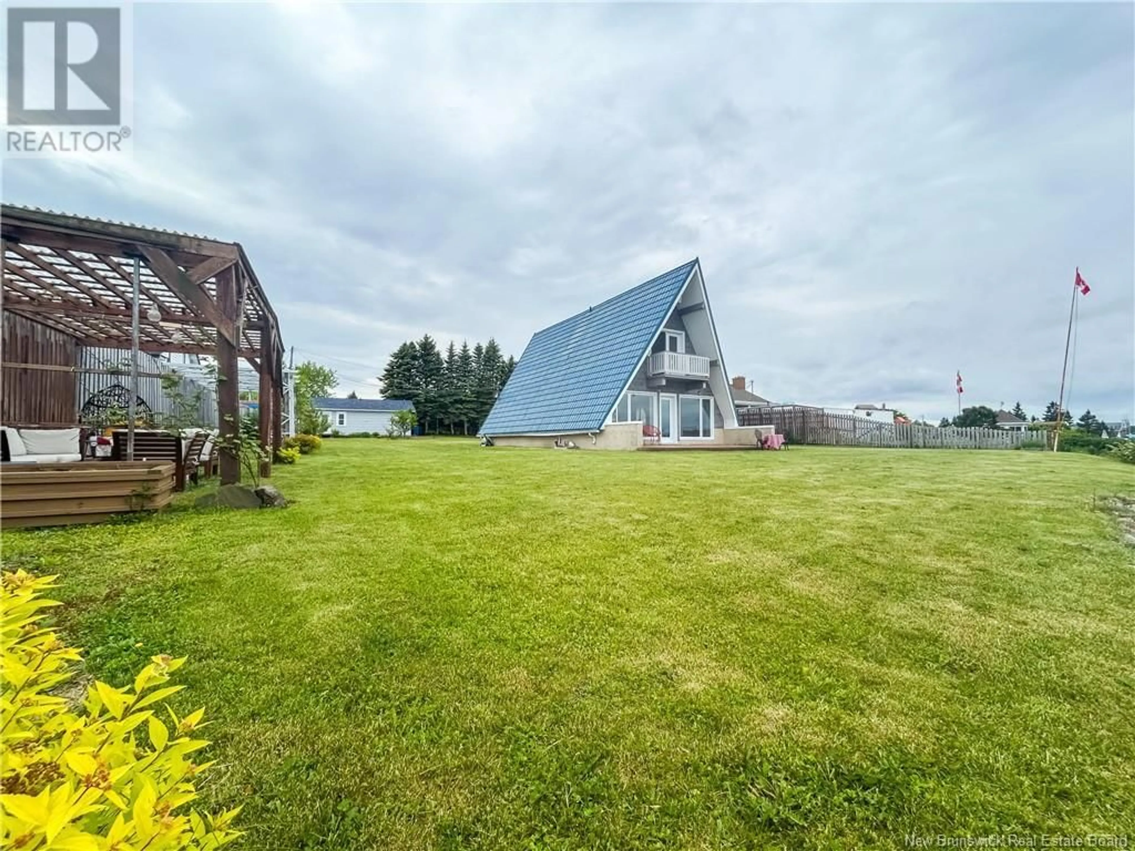 A pic from outside/outdoor area/front of a property/back of a property/a pic from drone, water/lake/river/ocean view for 11 21 LANE, Charlo New Brunswick E8E2V3