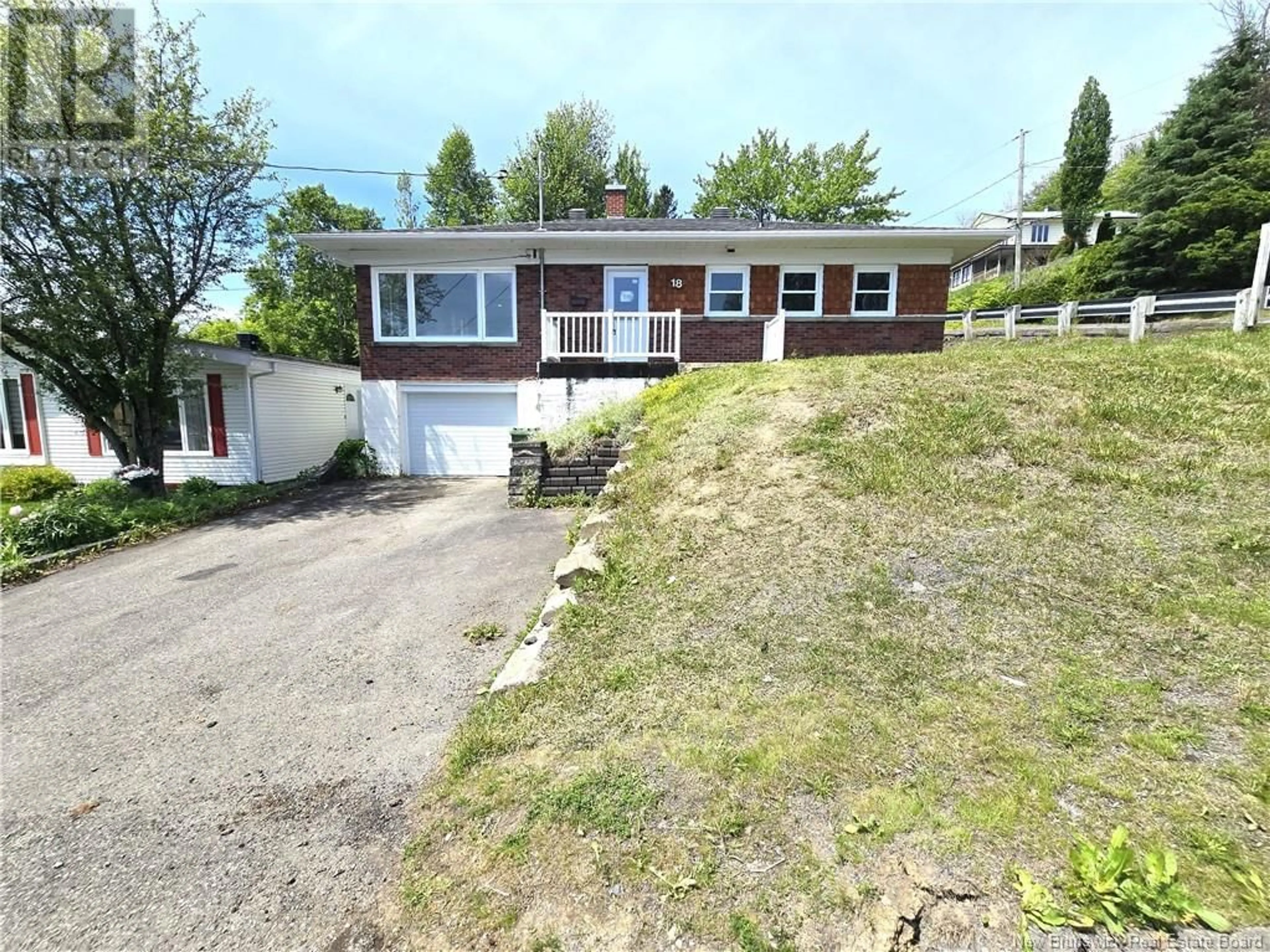 A pic from outside/outdoor area/front of a property/back of a property/a pic from drone, street for 18 23E AVENUE, Edmundston New Brunswick E3V2G5